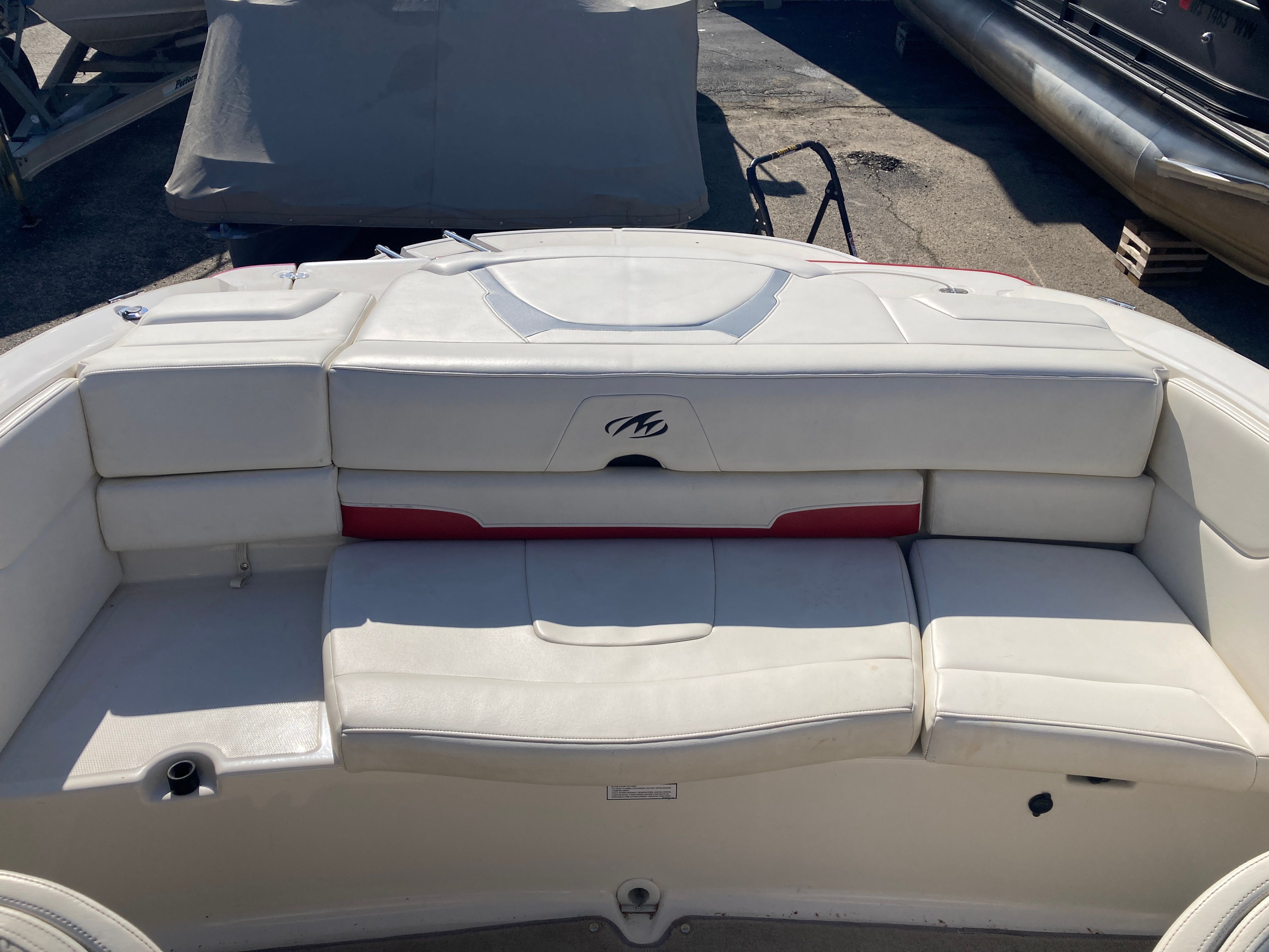 Rear view of a 2012 Monterey 204FS boat with white upholstery.