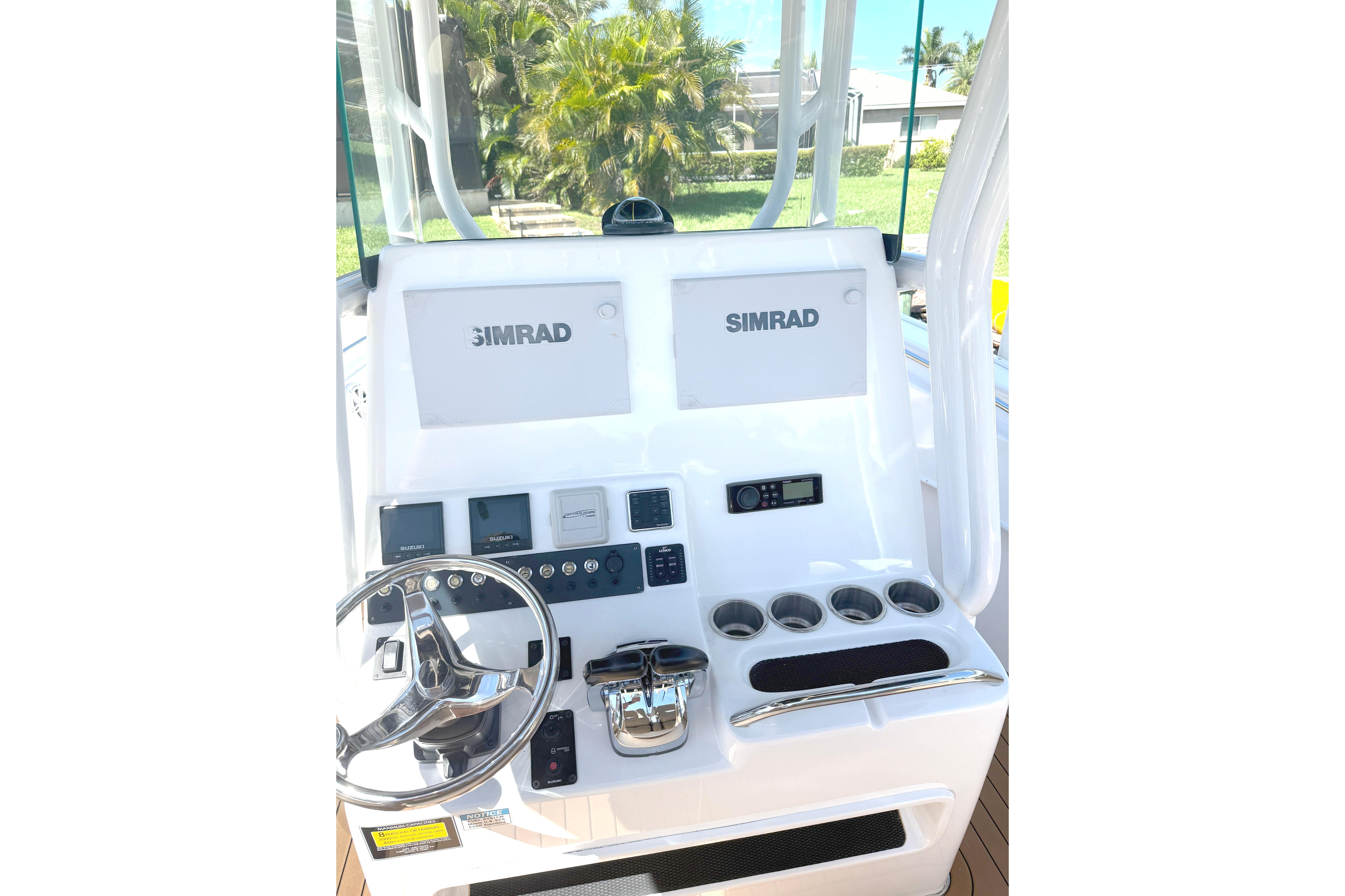 2019 Cape Horn 27XS boat console with Simrad displays and steering wheel.