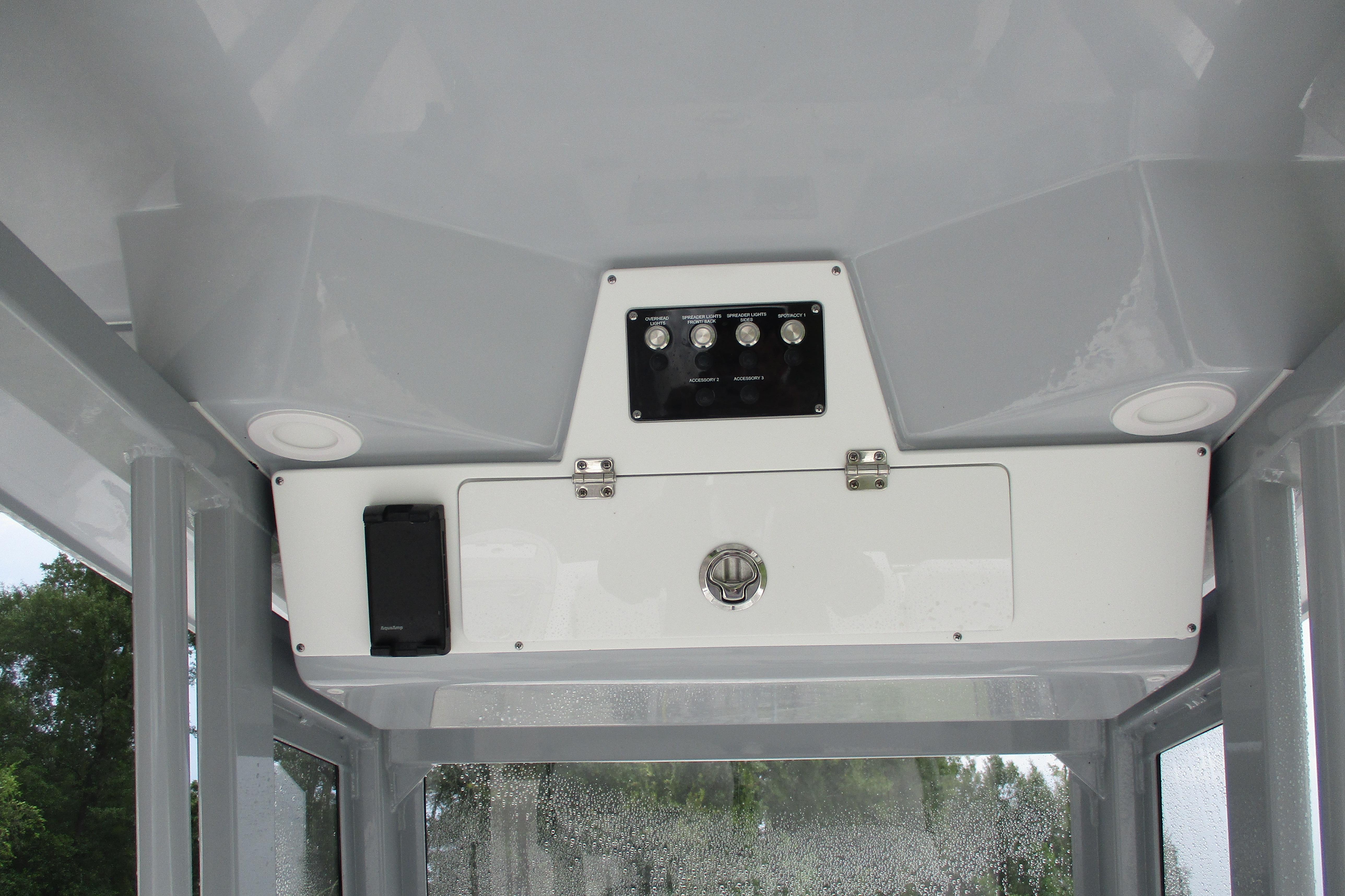 2026 Sea Fox 248 Commander boat console with control panel and storage compartment.
