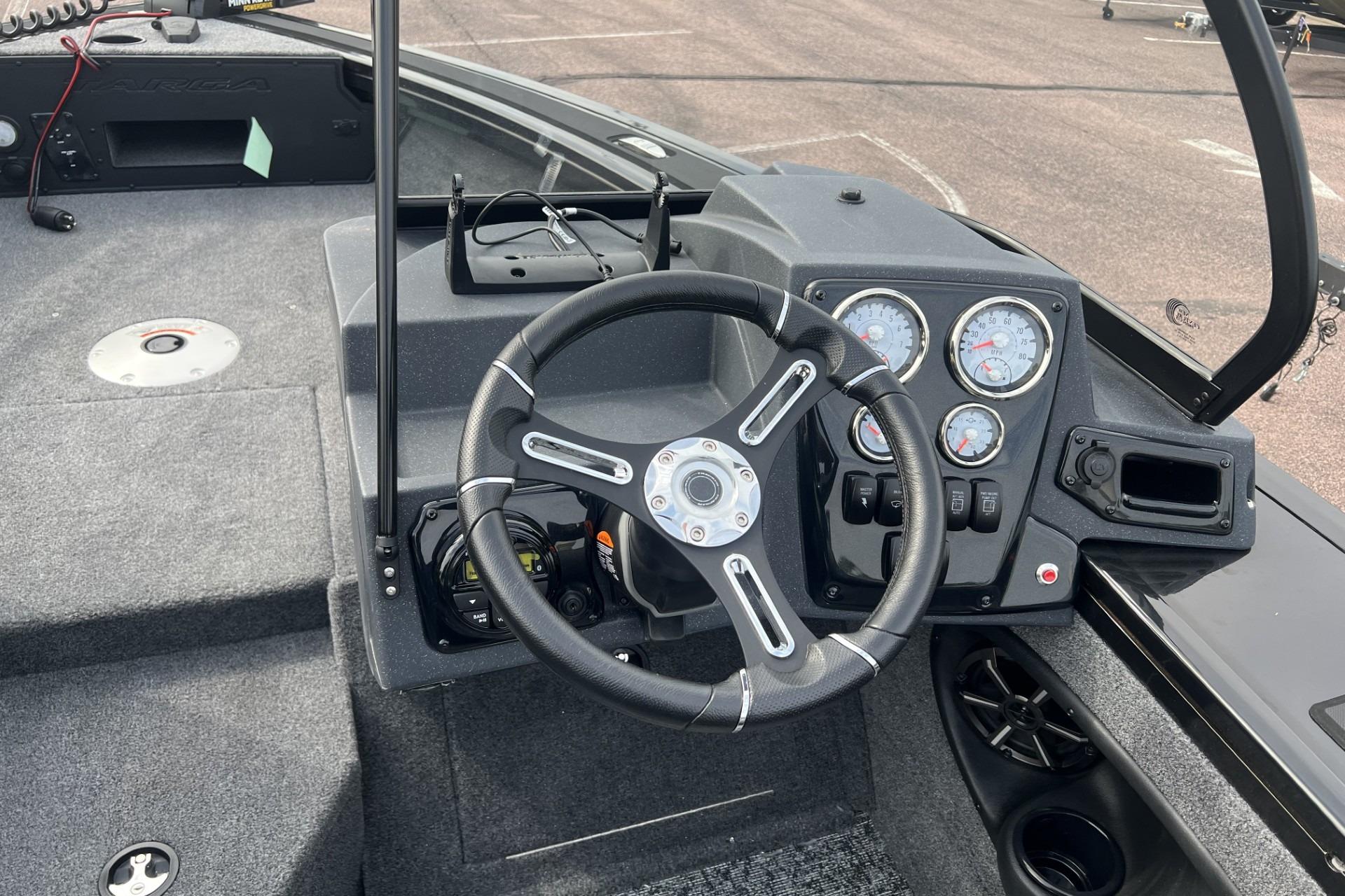 2025 Tracker Targa V-18 Combo boat dashboard with steering wheel and gauges.