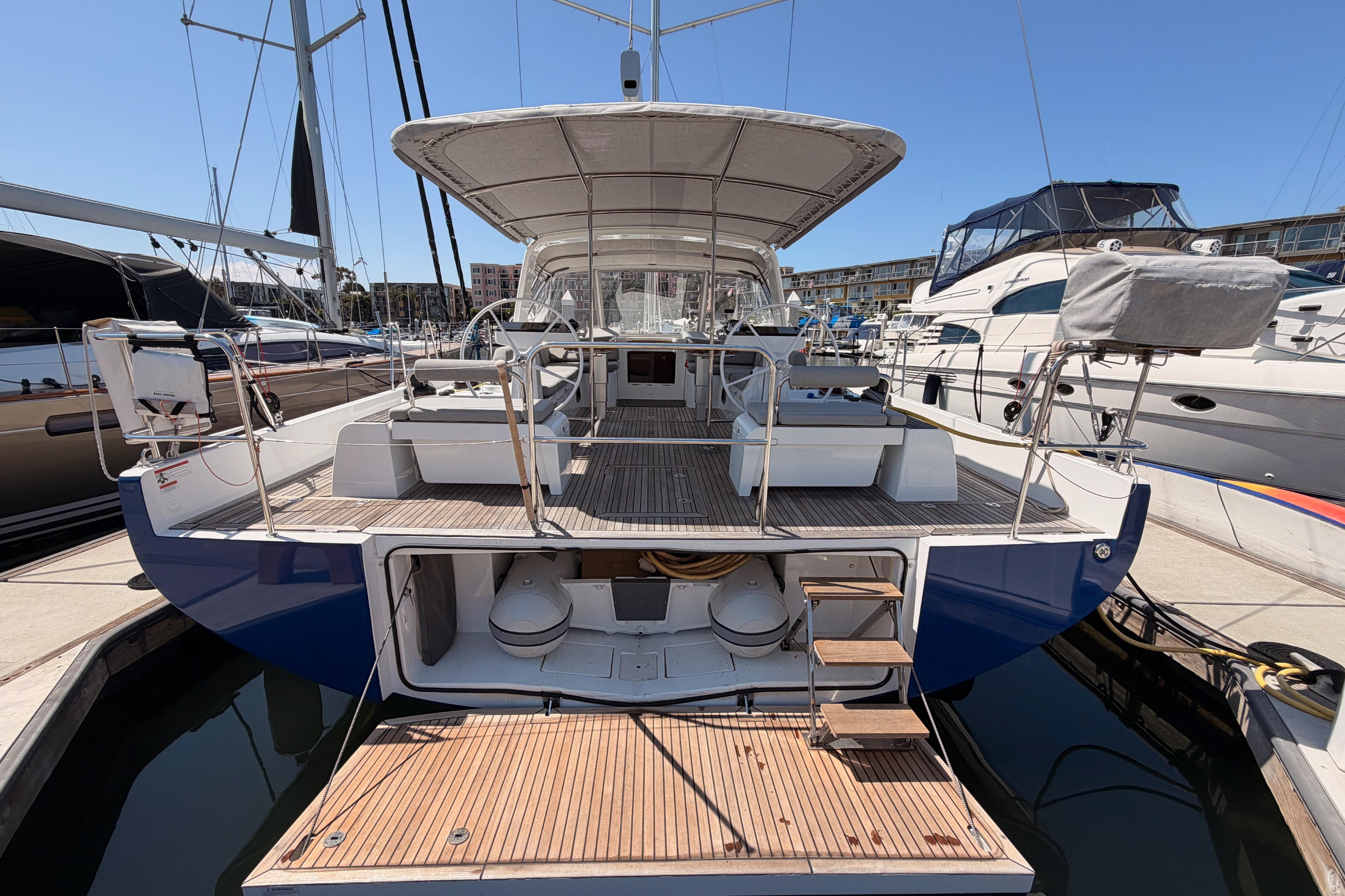 2022 Beneteau Oceanis Yacht 54 docked, showcasing spacious deck and modern design.