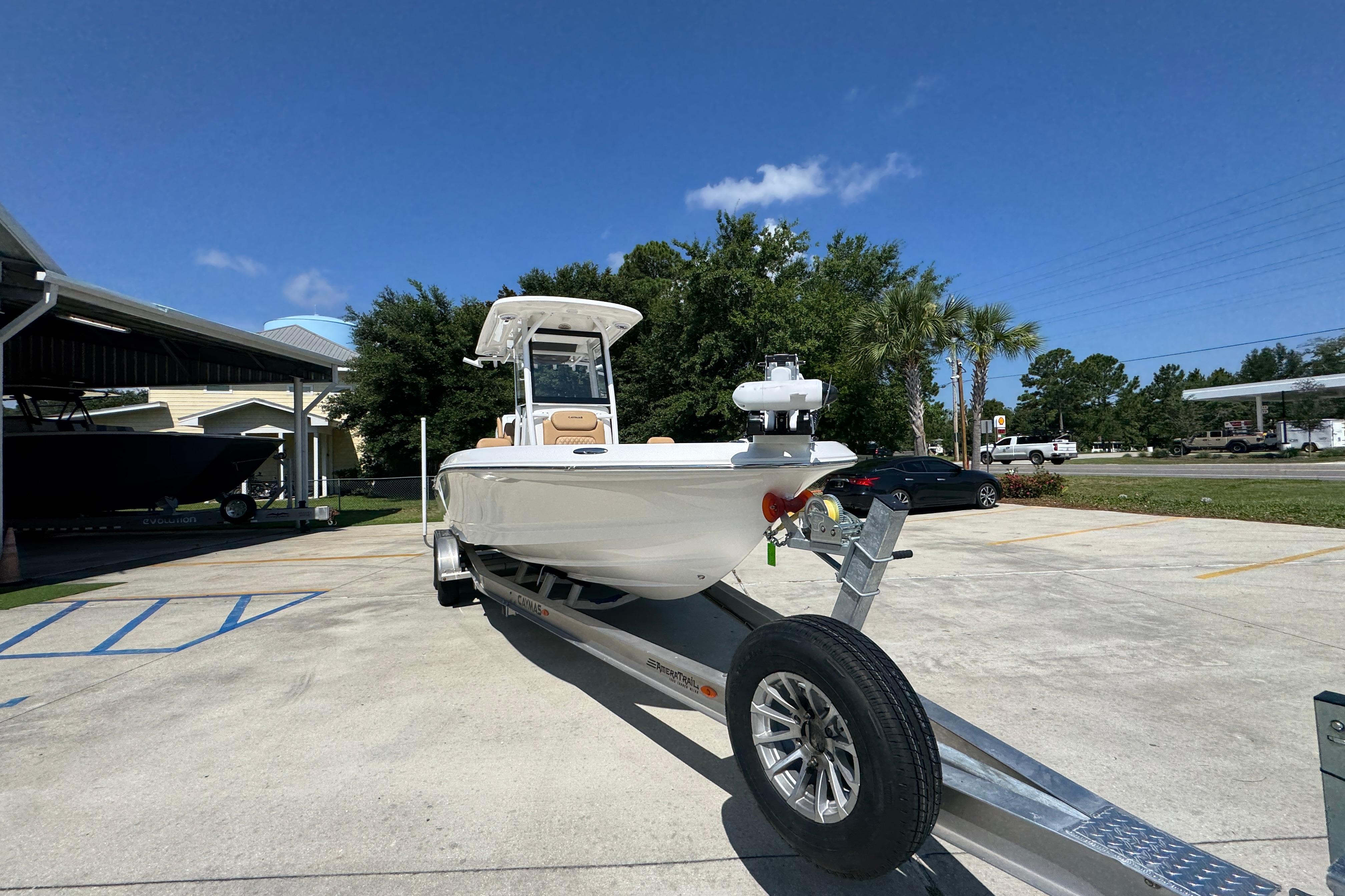 2027 Caymas 26 HB boat on trailer in sunny outdoor setting.