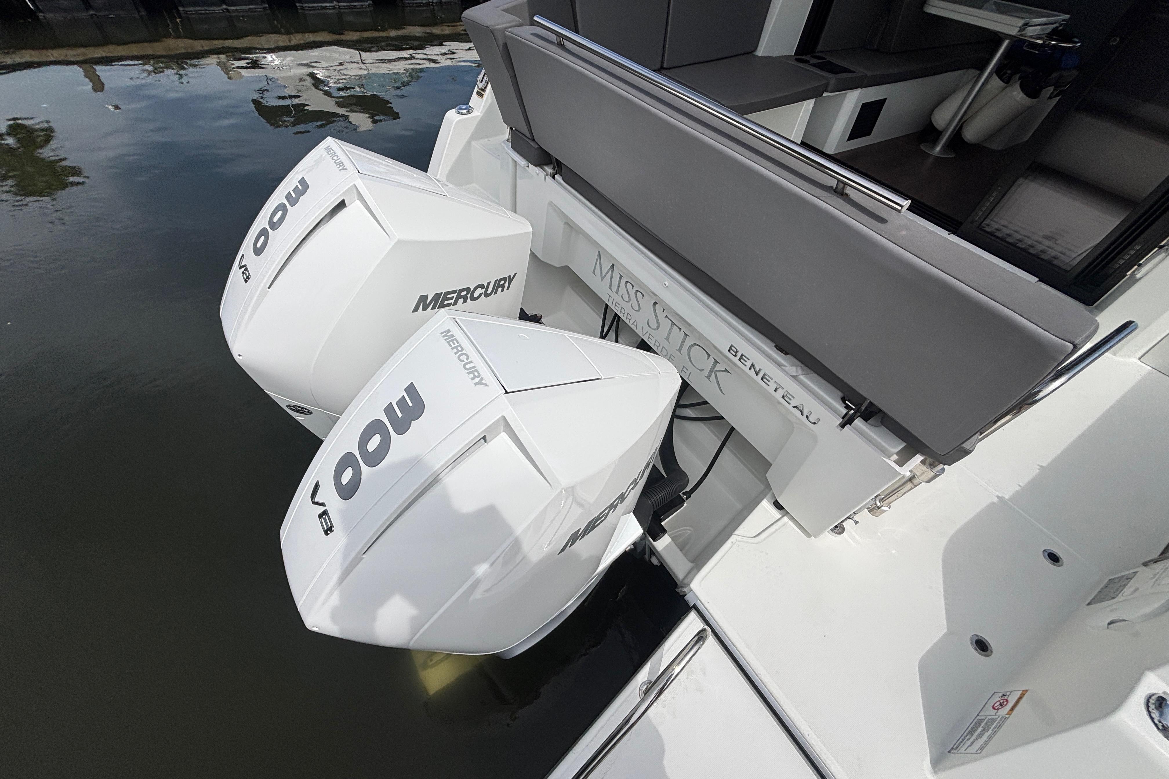 2024 Beneteau Antares 11 with twin Mercury 300 V8 engines, docked on calm water.