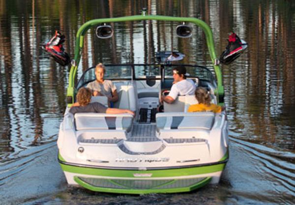 Manufacturer Provided Image: 2013 Nautique Super Air Nautique 230 boat with passengers on a lake.