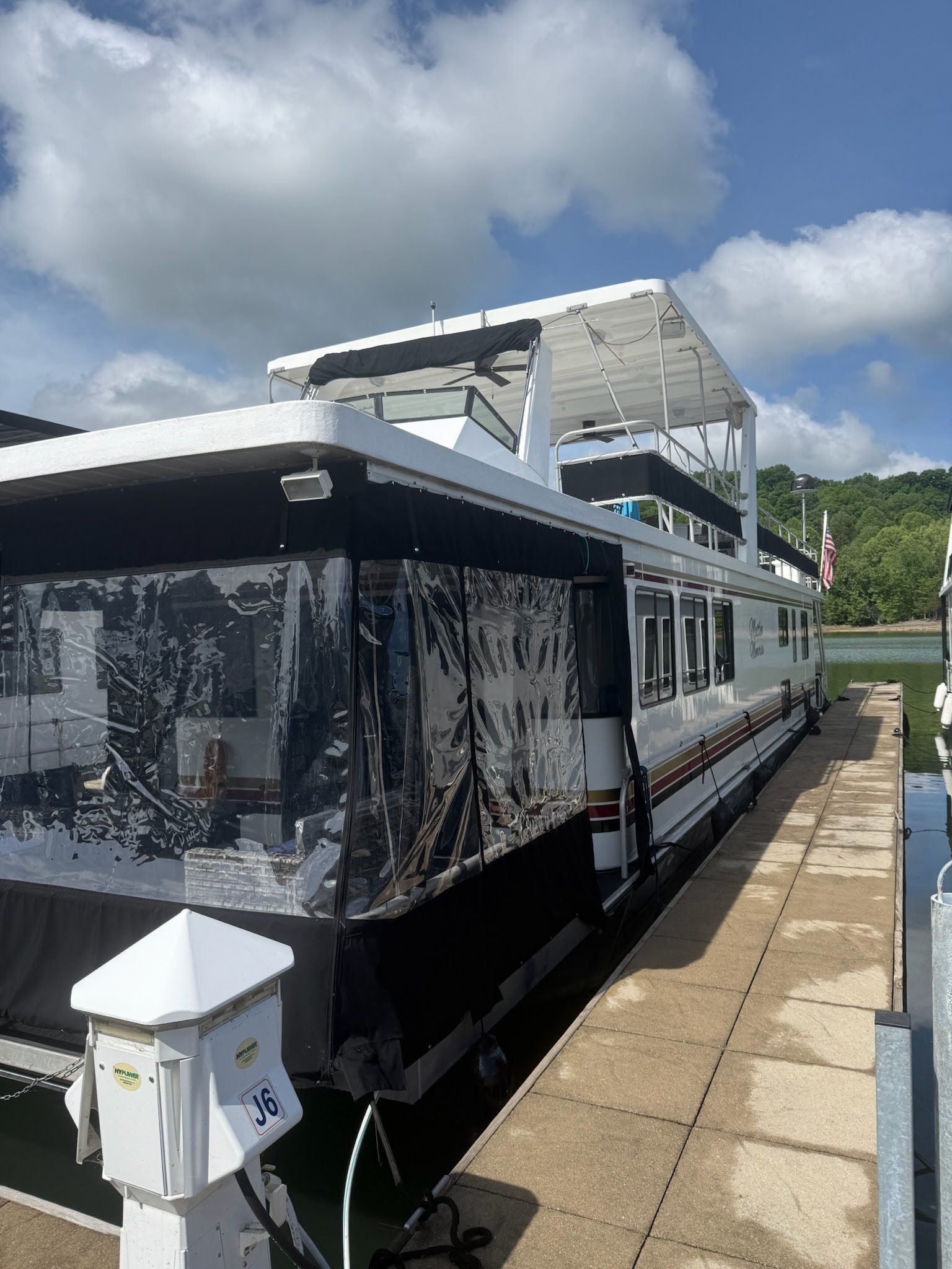 2003 Lakeview 16x70 houseboat docked at marina.