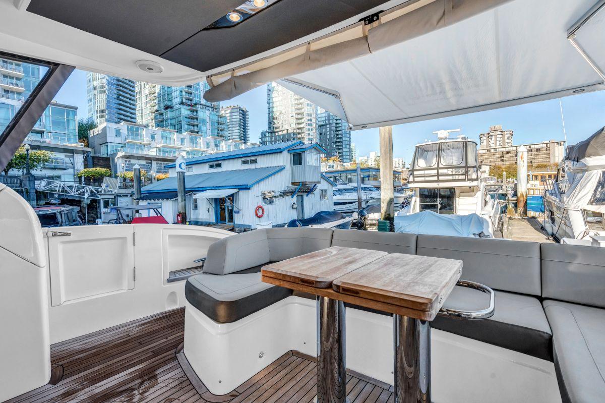 Luxurious 2018 Princess S60 yacht interior with city marina view.
