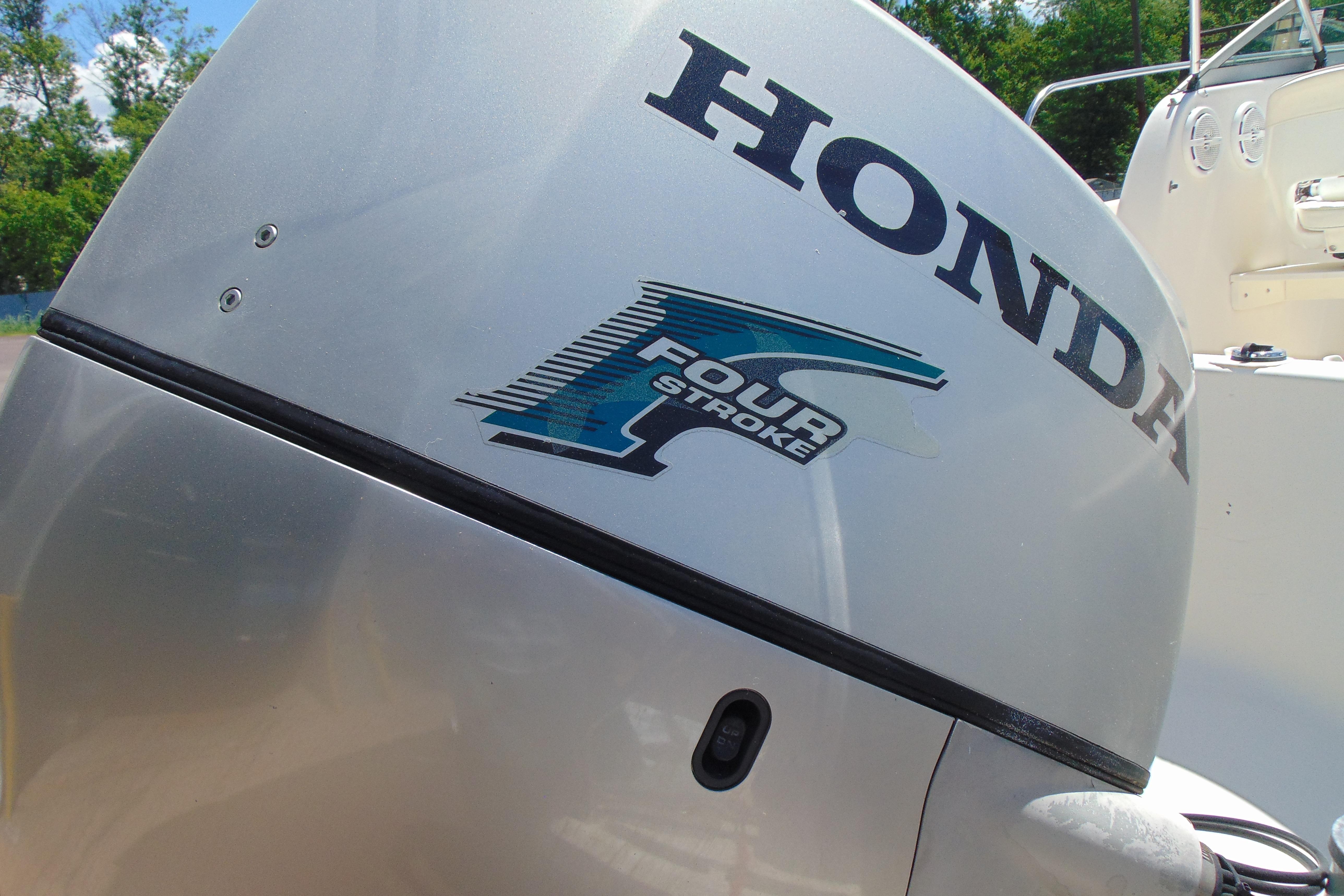 Honda four-stroke outboard motor on a 2002 Trophy Walkaround boat.