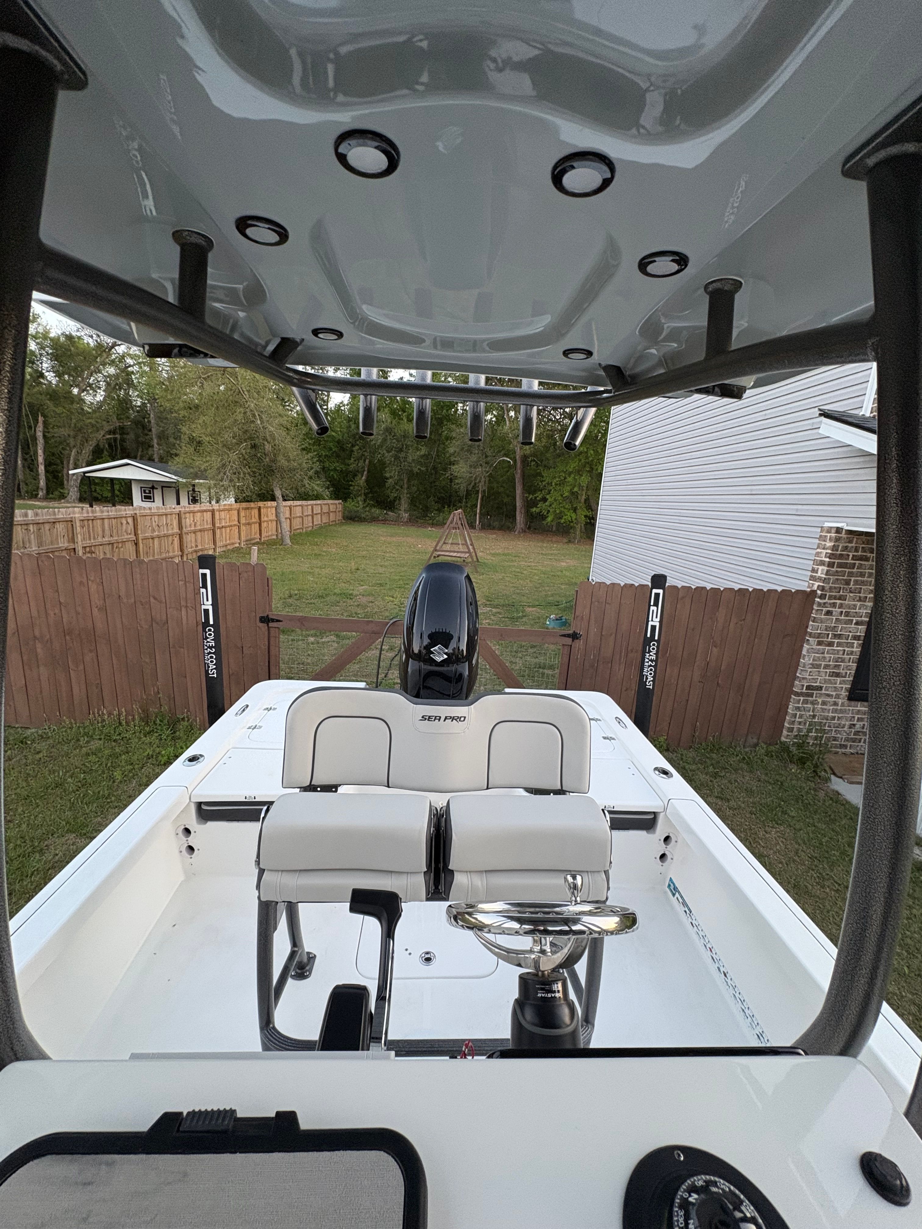 Interior view of a 2025 Sea Pro 230 Bay boat in a backyard.