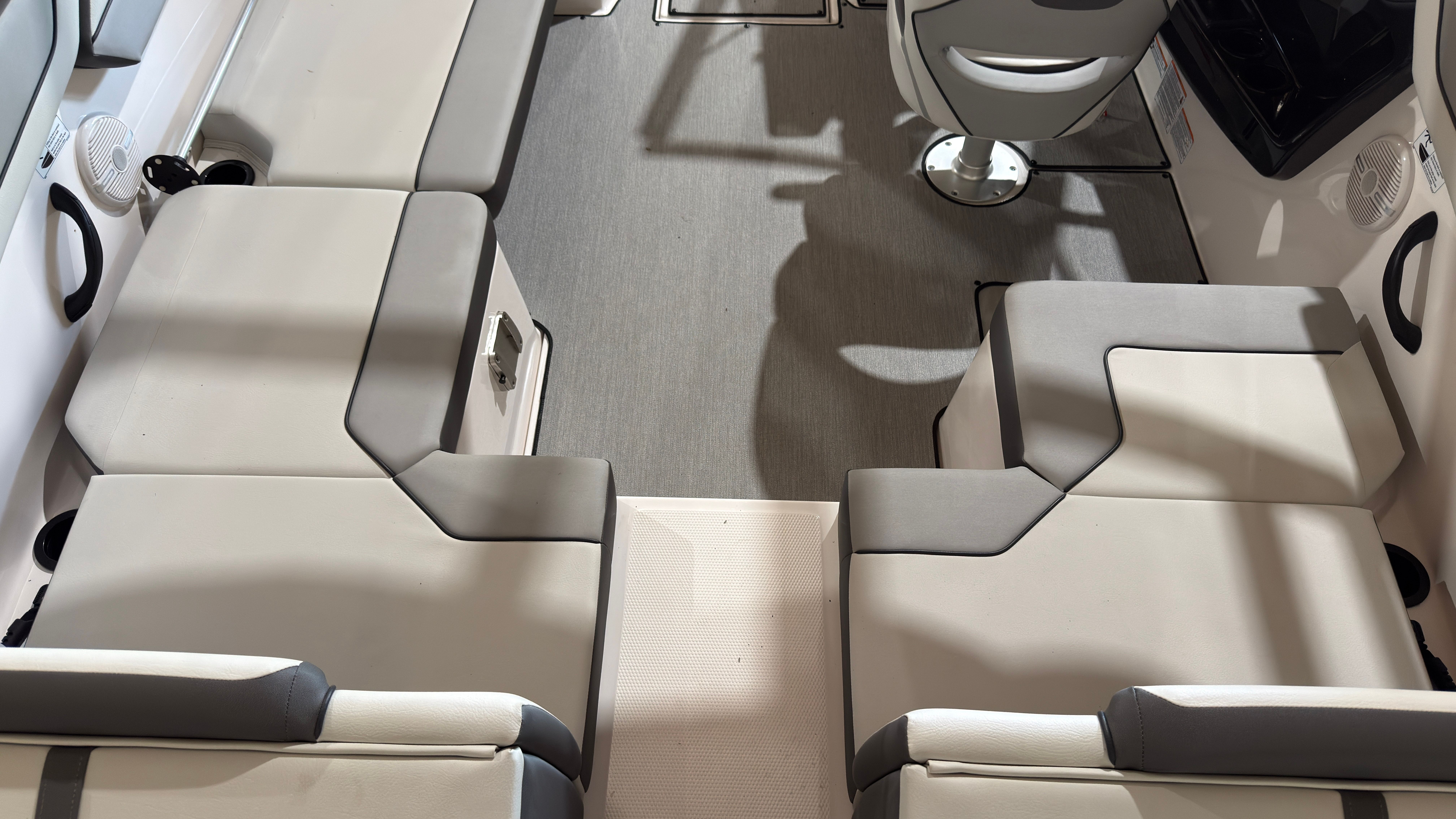 Interior of 2024 Yamaha AR220 boat with gray seating.