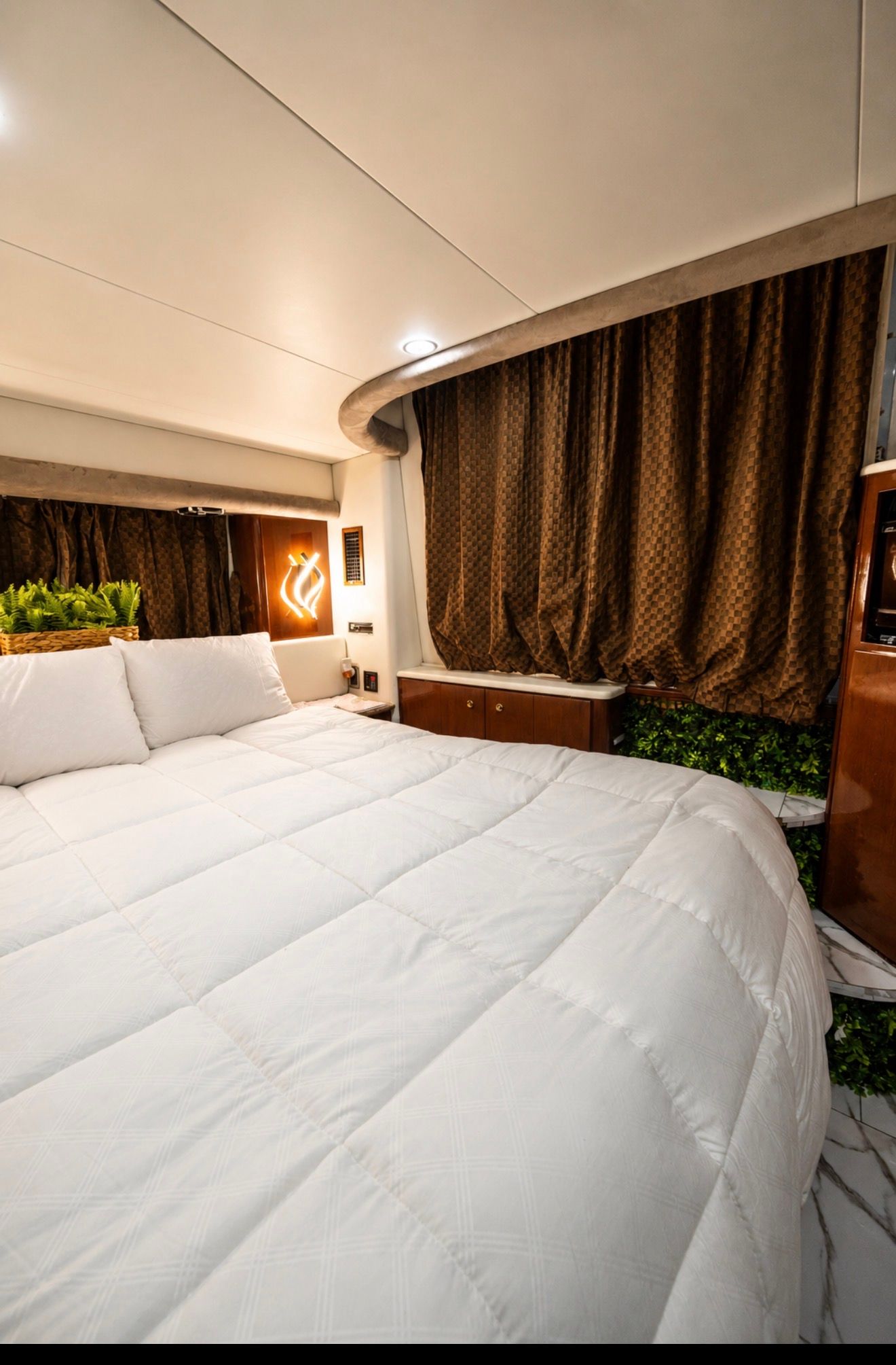 Luxurious bedroom in a 2007 Meridian 459 Motoryacht.