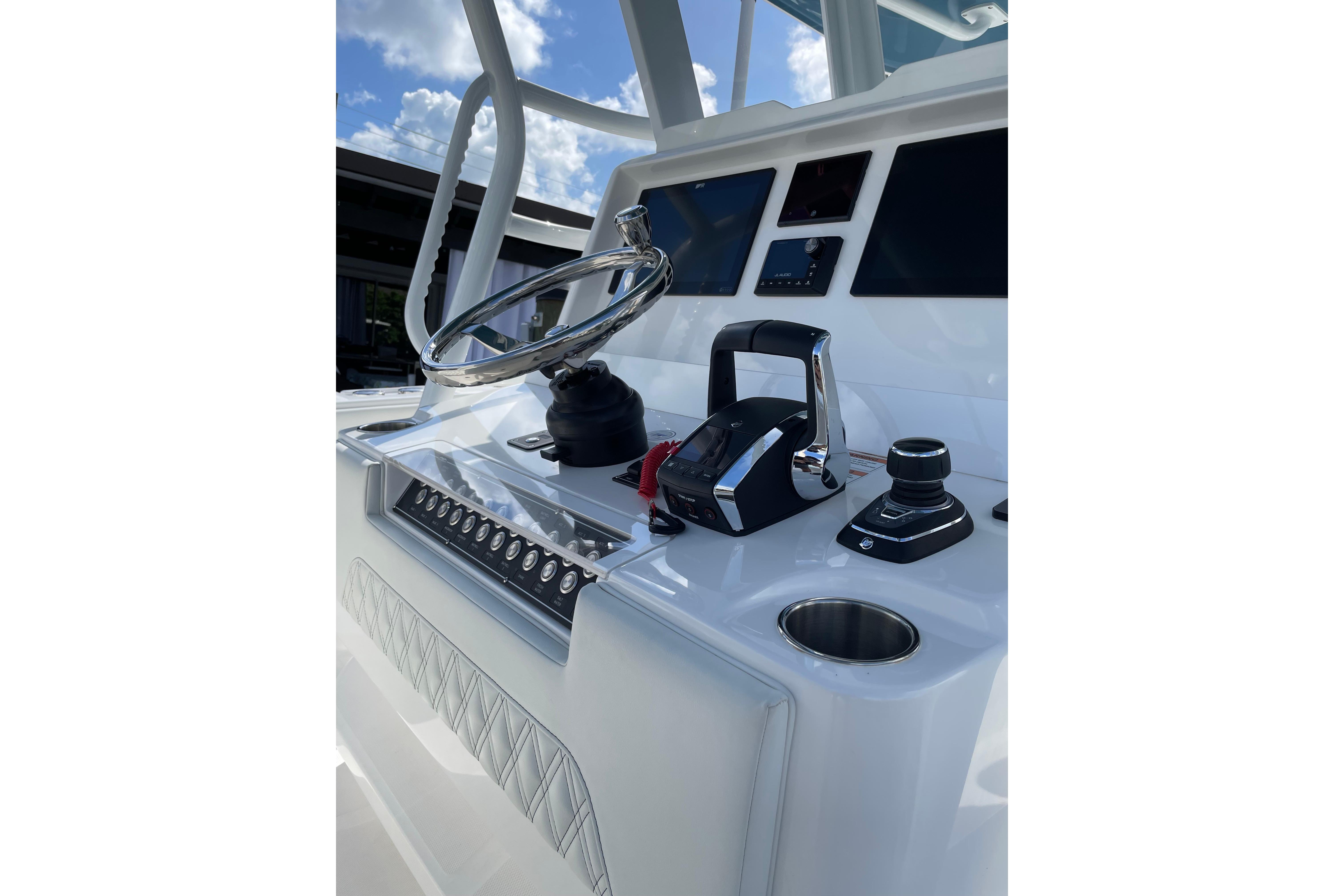 2024 Invincible 36 Open Fisherman helm with modern controls and steering wheel.
