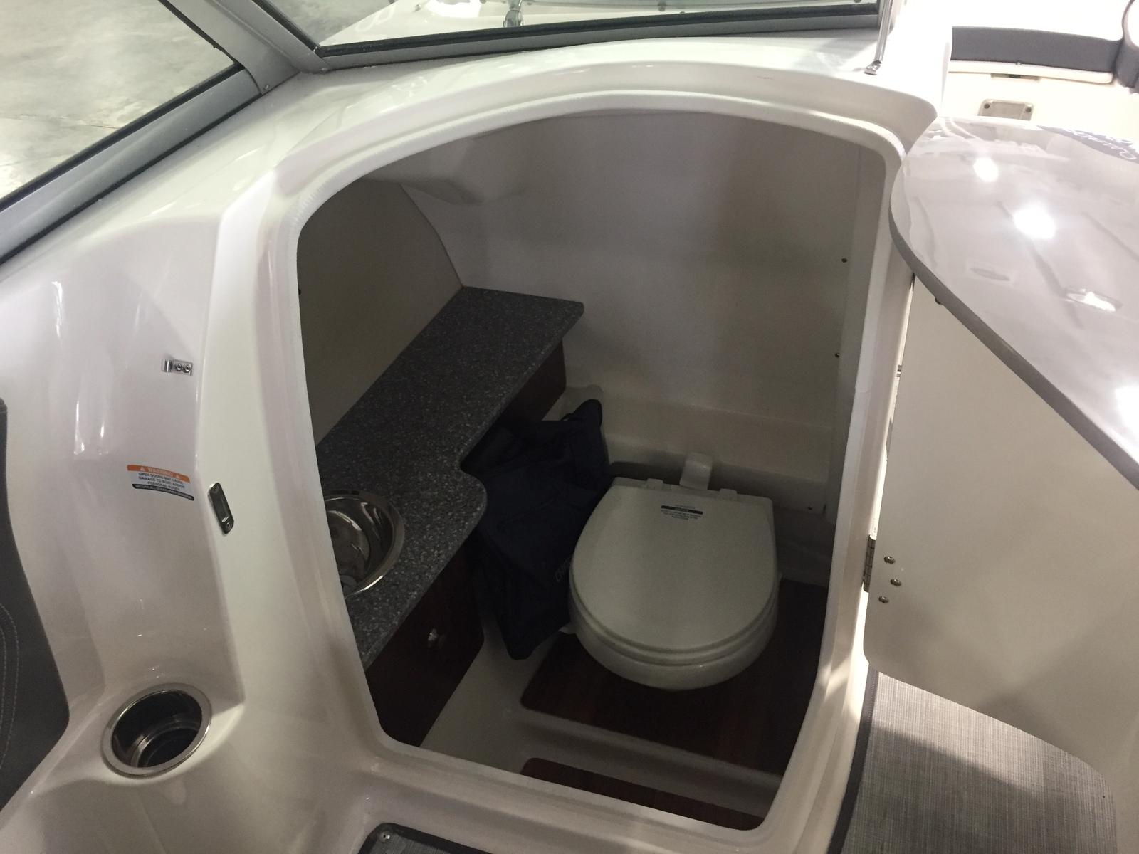 Interior of 2019 Chaparral 264 Sunesta featuring a toilet.