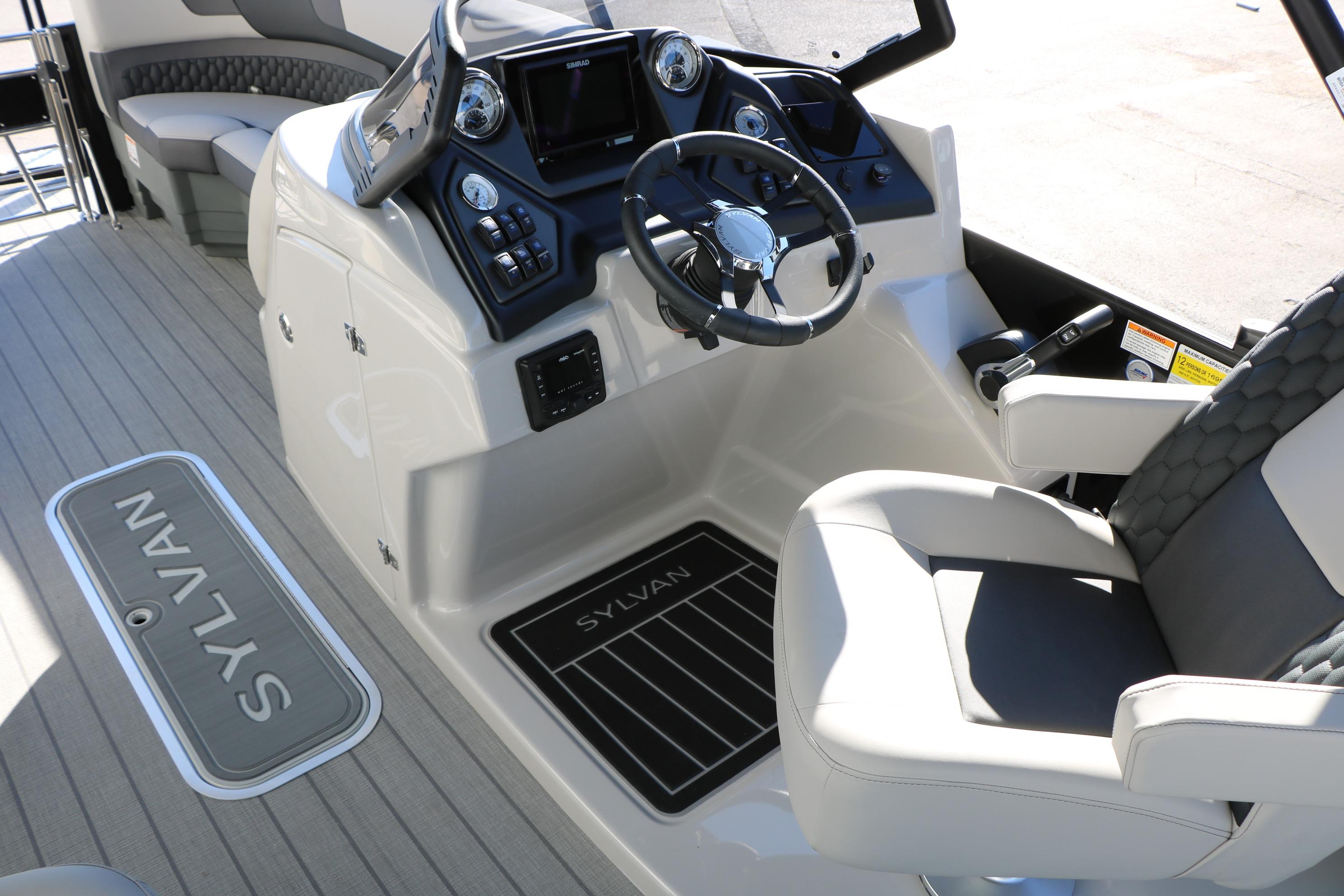 2026 Sylvan L3 CLZ DH boat interior with steering wheel and seating.