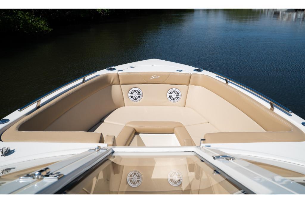 2023 Scout 240 Dorado boat interior with tan seating and speakers.