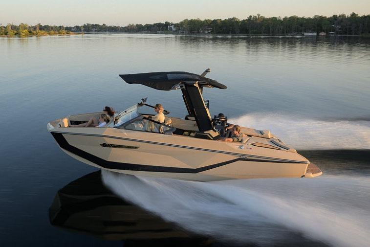 Manufacturer Provided Image: 2026 Nautique Super Air Nautique G23 cruising on a serene lake at sunset.