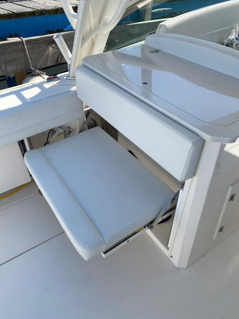 2023 Cobia 330 boat with foldable seating area.