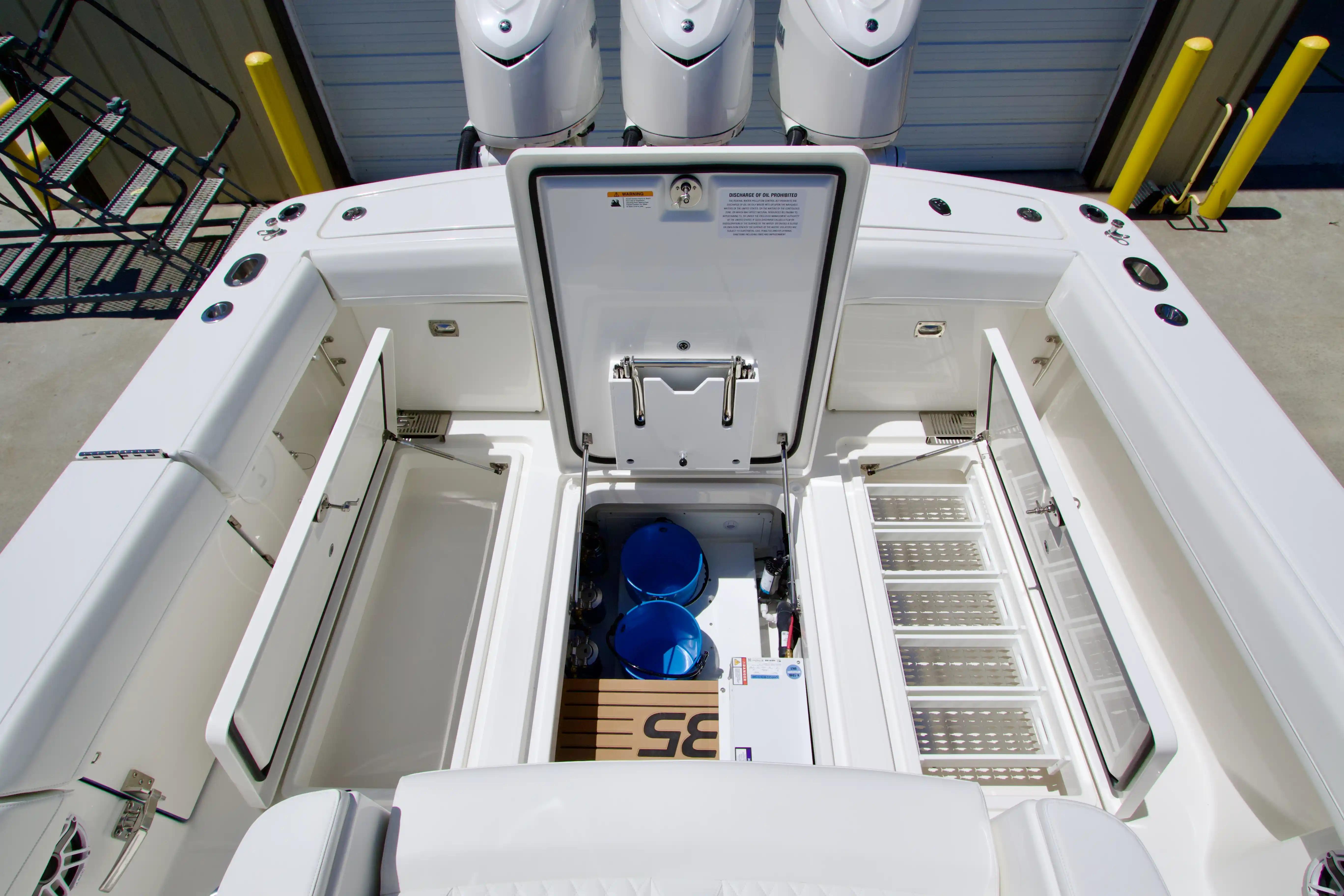 2027 Regulator 35 boat interior with open storage compartments and visible engines.