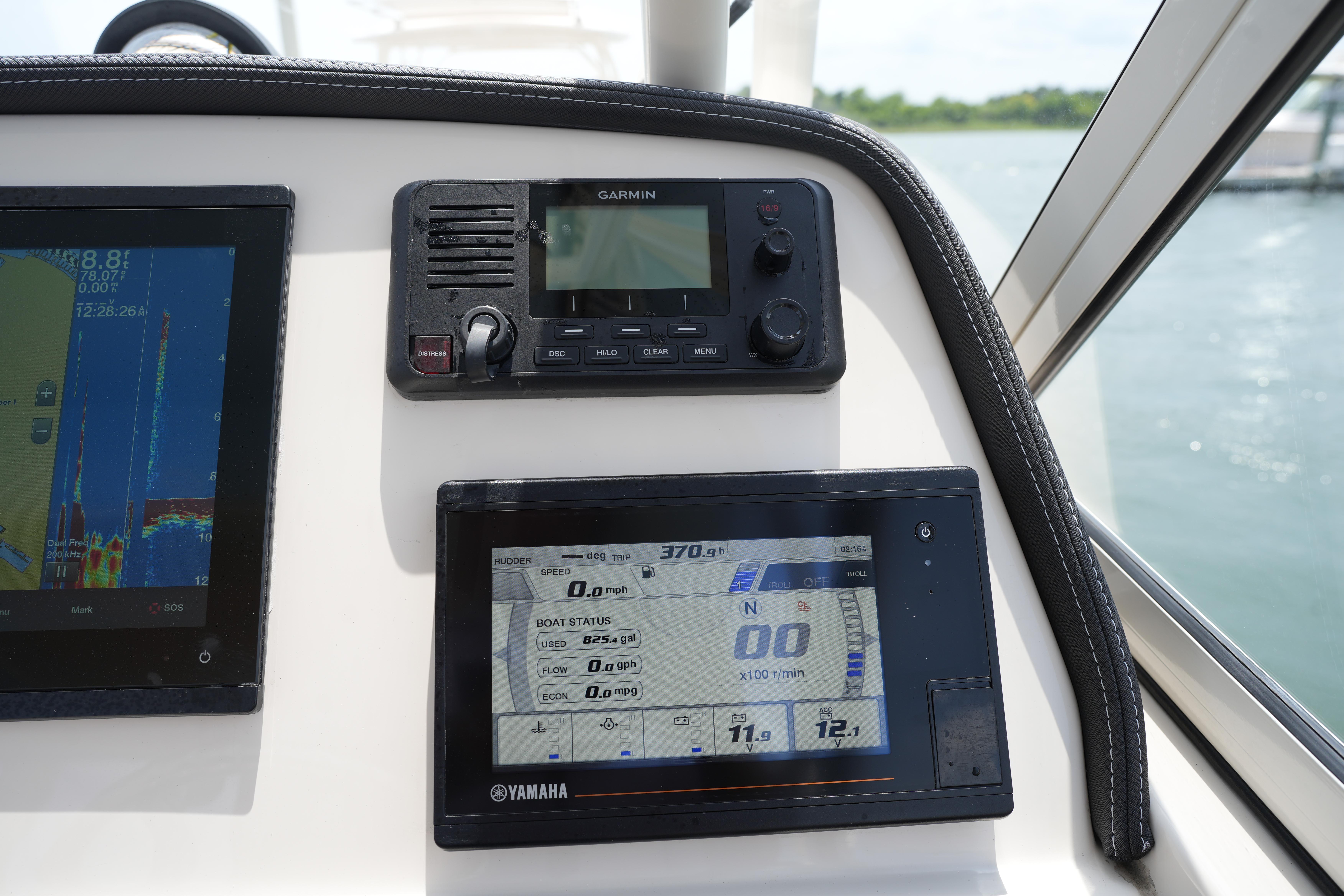 Dashboard of 2021 Grady-White Freedom 235 boat with Garmin and Yamaha displays.