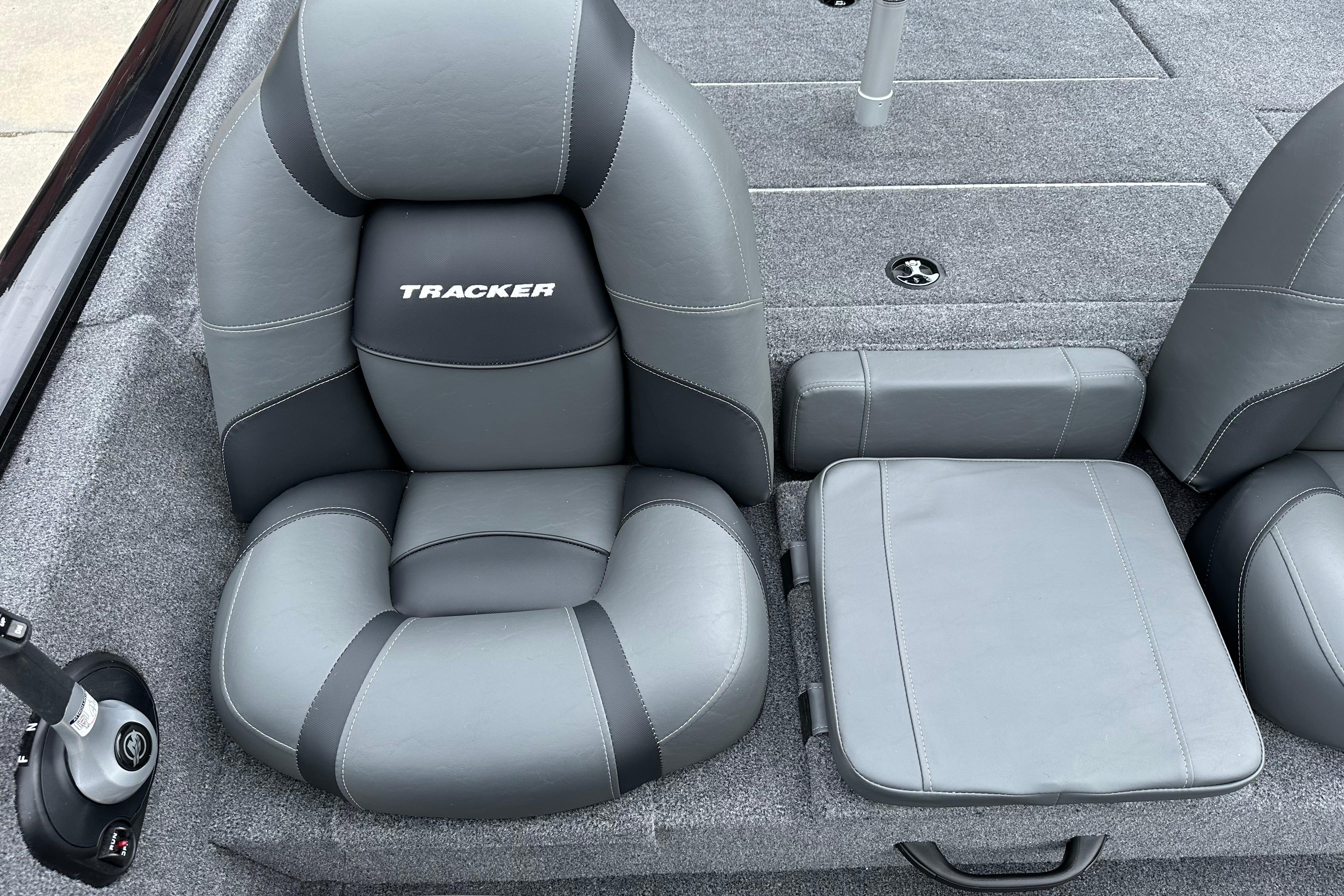 2026 Tracker Pro Team 190 boat interior with gray cushioned seating.