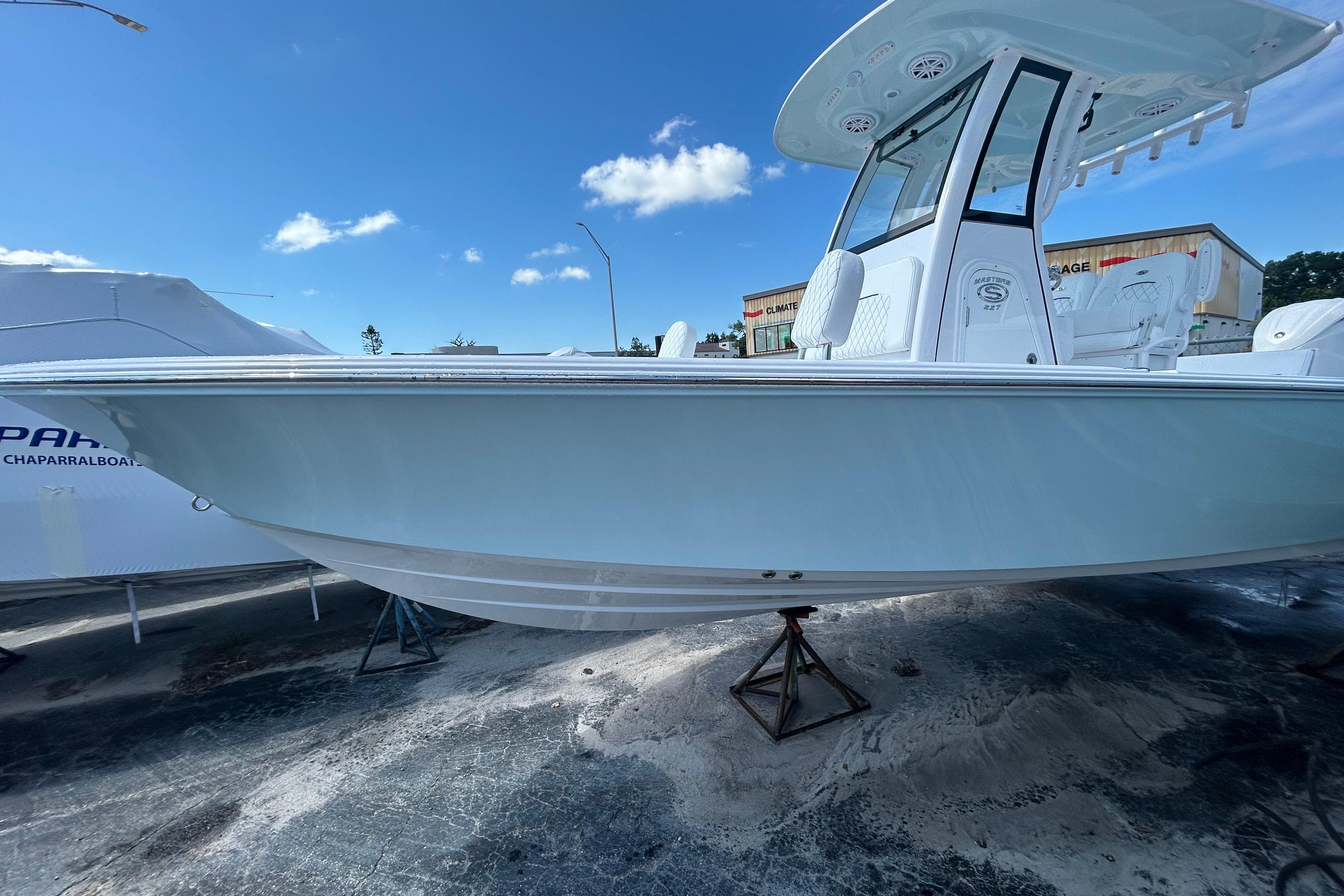 2025 Sportsman Masters 227 Bay Boat on display under clear blue sky.