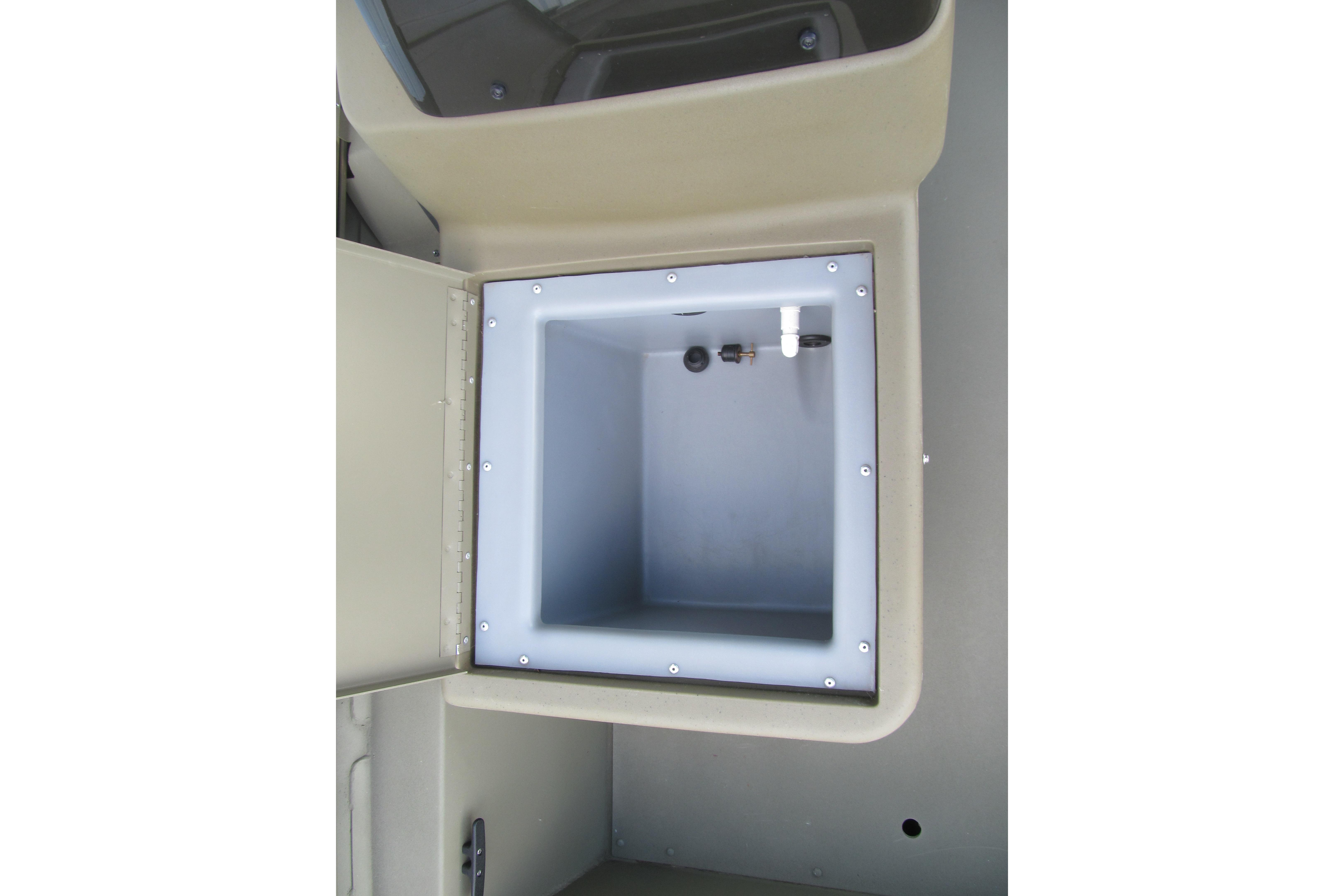 2018 Tracker Grizzly 1754 SC boat storage compartment, open and empty.