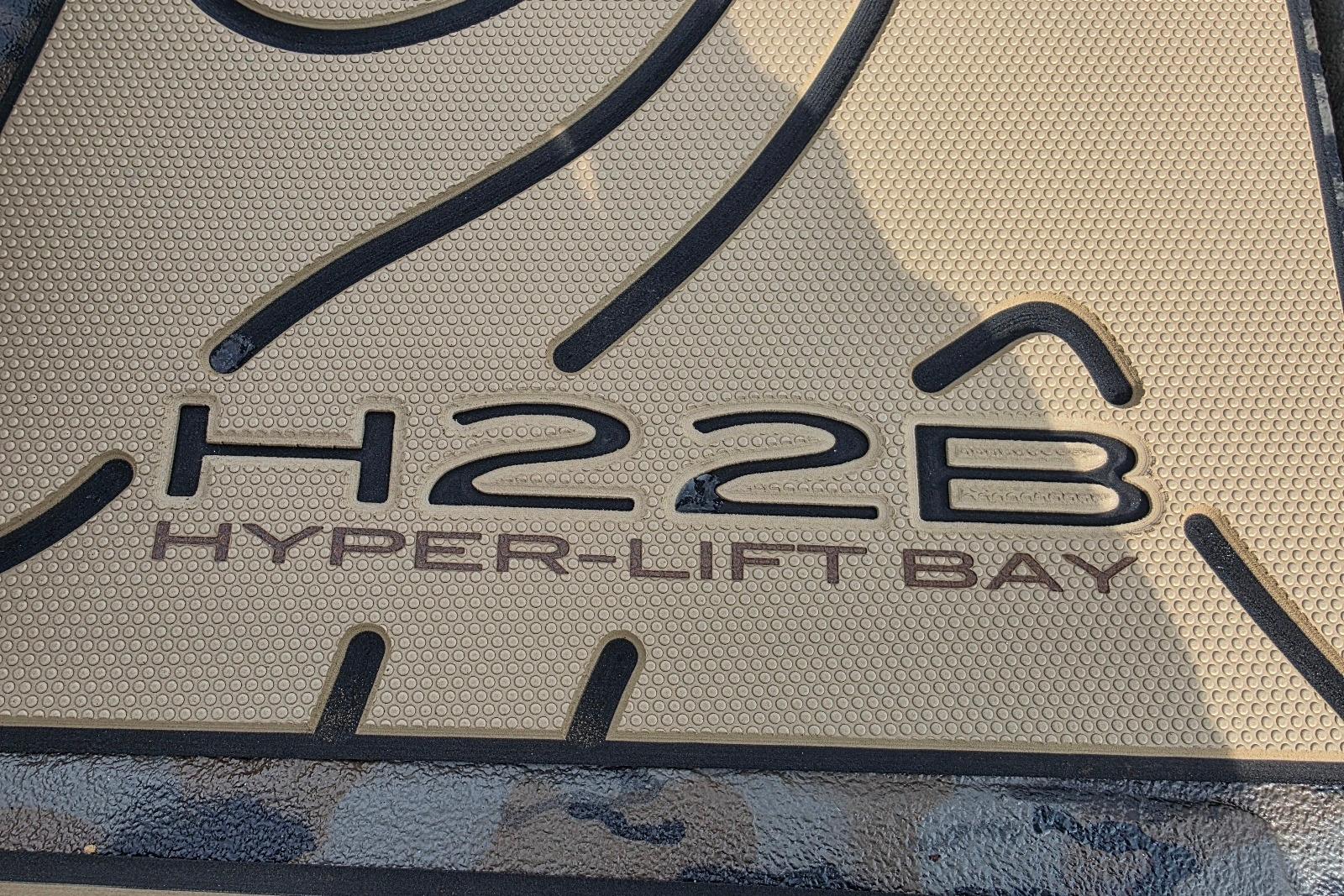 2026 Xpress H22B Hyper-Lift Bay logo on textured surface.