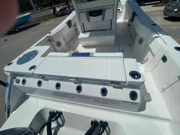 2023 Robalo R270 boat interior with seating and storage compartments.