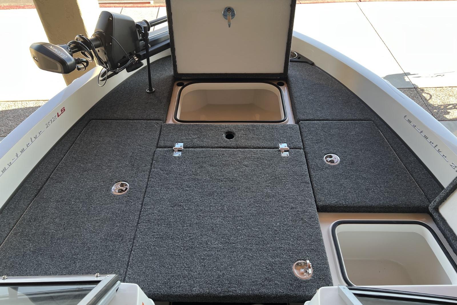 2025 Ranger 212LS boat interior with open storage compartments and fishing equipment.