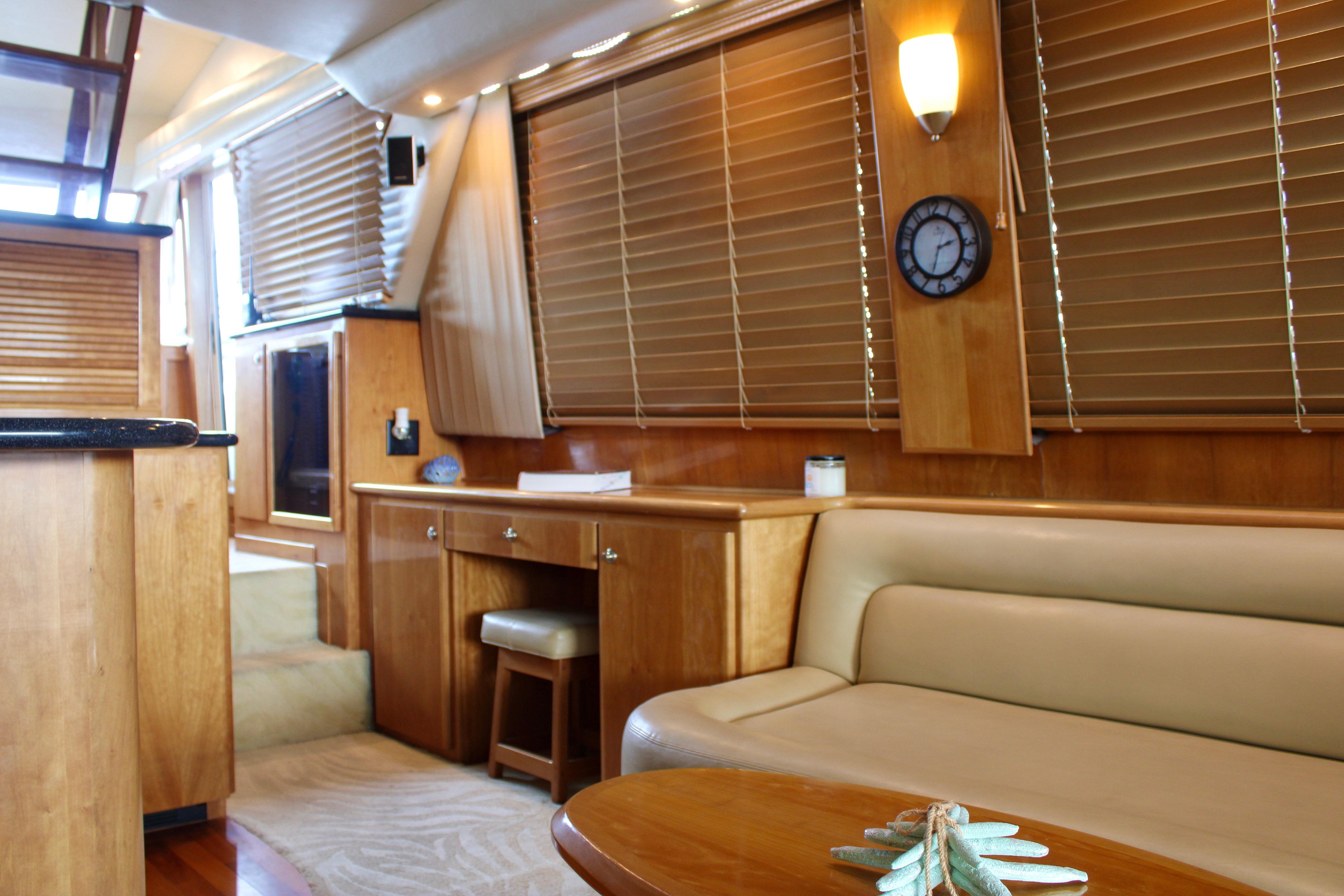 Luxurious interior of a 2007 Navigator 5100 yacht with elegant wood finishes.