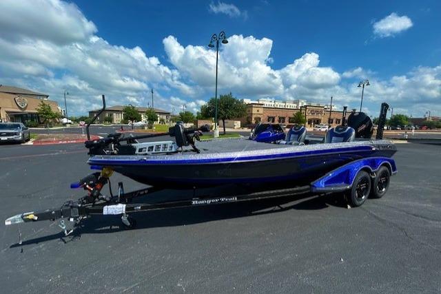 2026 Ranger Z521 boat on trailer in parking lot under blue sky.
