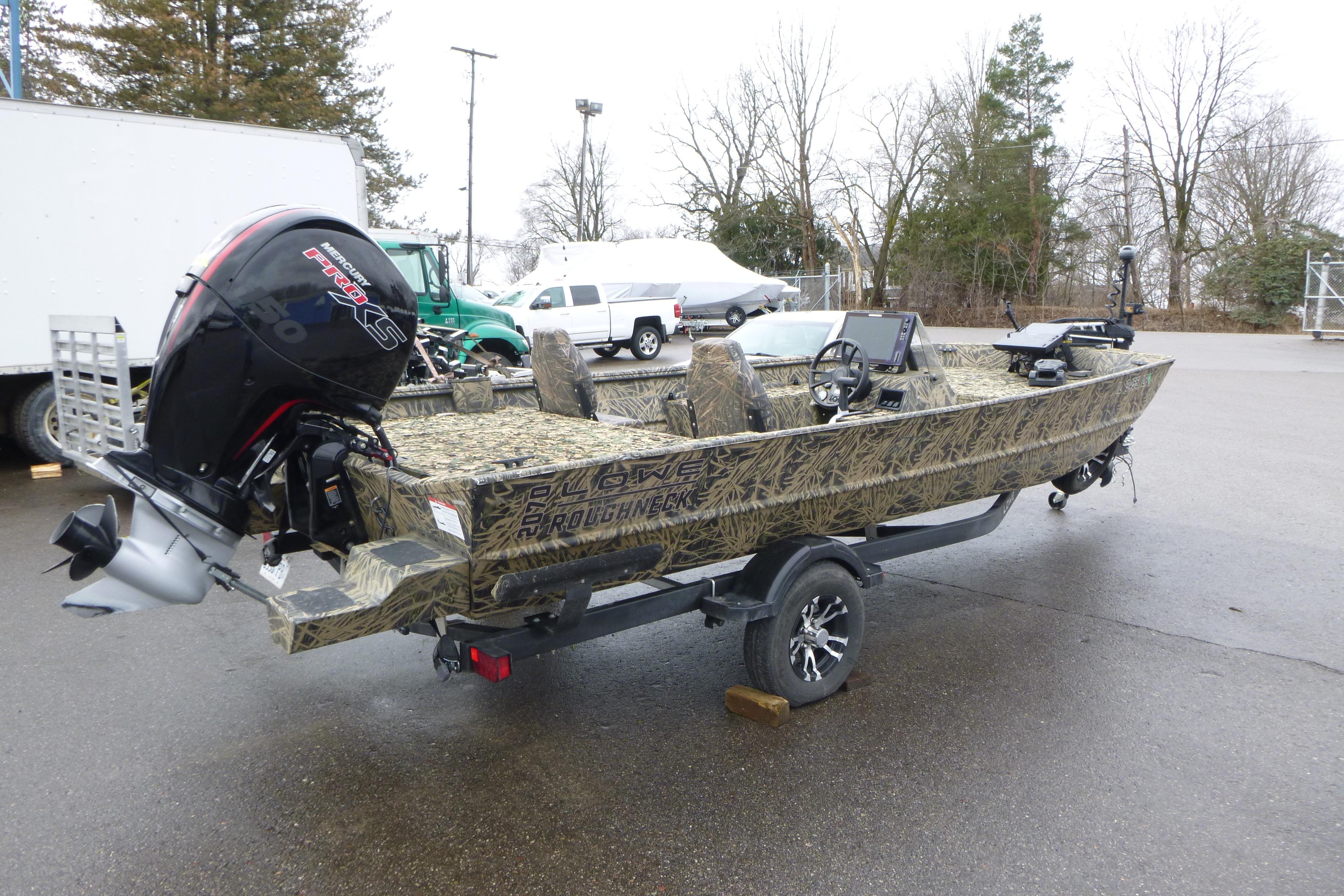 2024 Lowe Roughneck 2070 boat with camouflage design and powerful outboard motor.