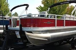 2026 Sun Tracker Bass Buggy 18 DLX pontoon boat with red exterior and sleek design.