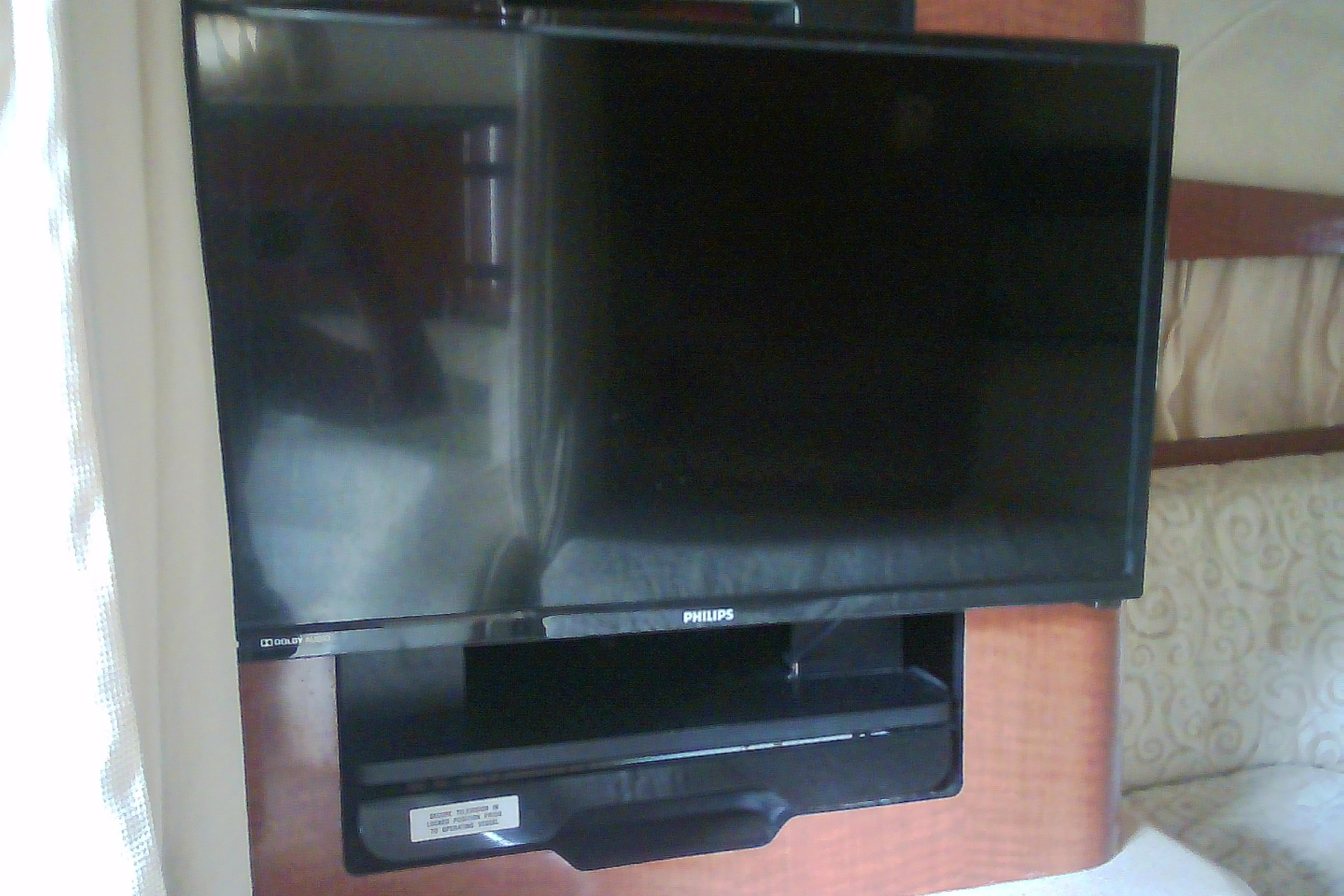 Flat-screen TV in 2005 Sea Ray 300 Sundancer cabin interior.