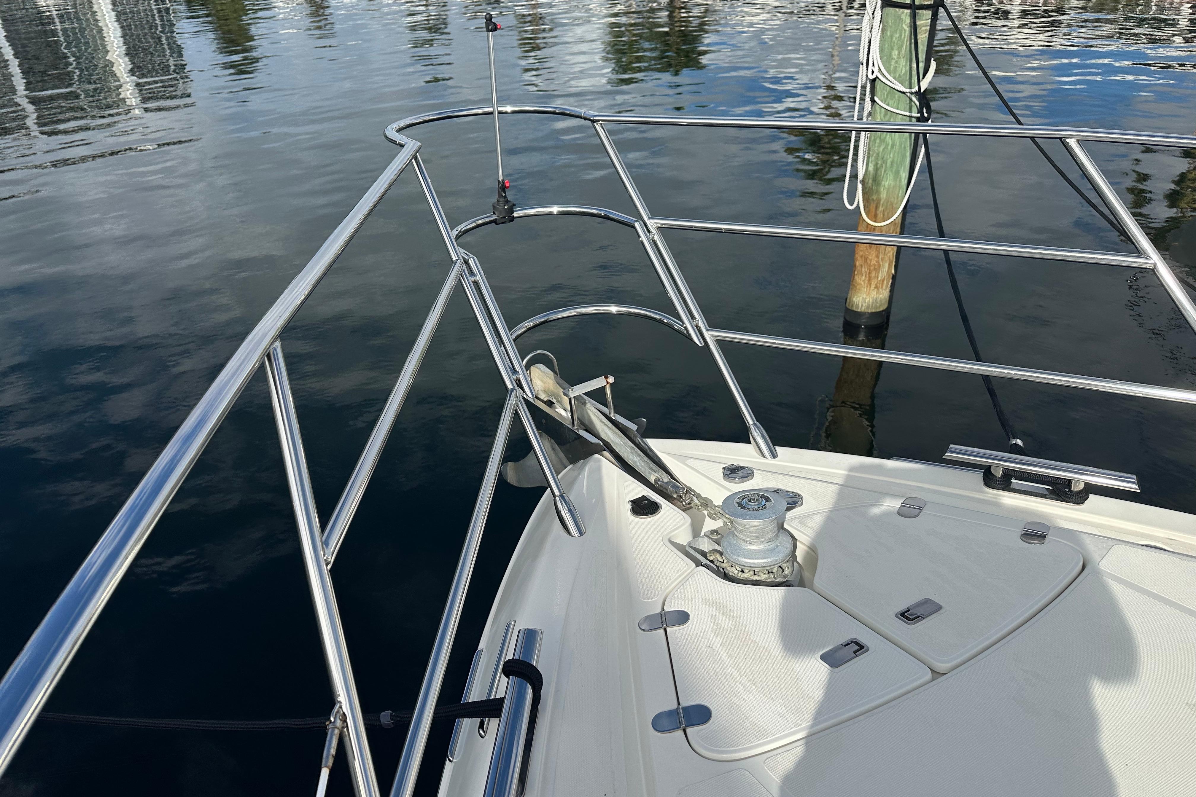 Bow of 2004 Azimut 55E yacht with stainless steel railings and anchor system.
