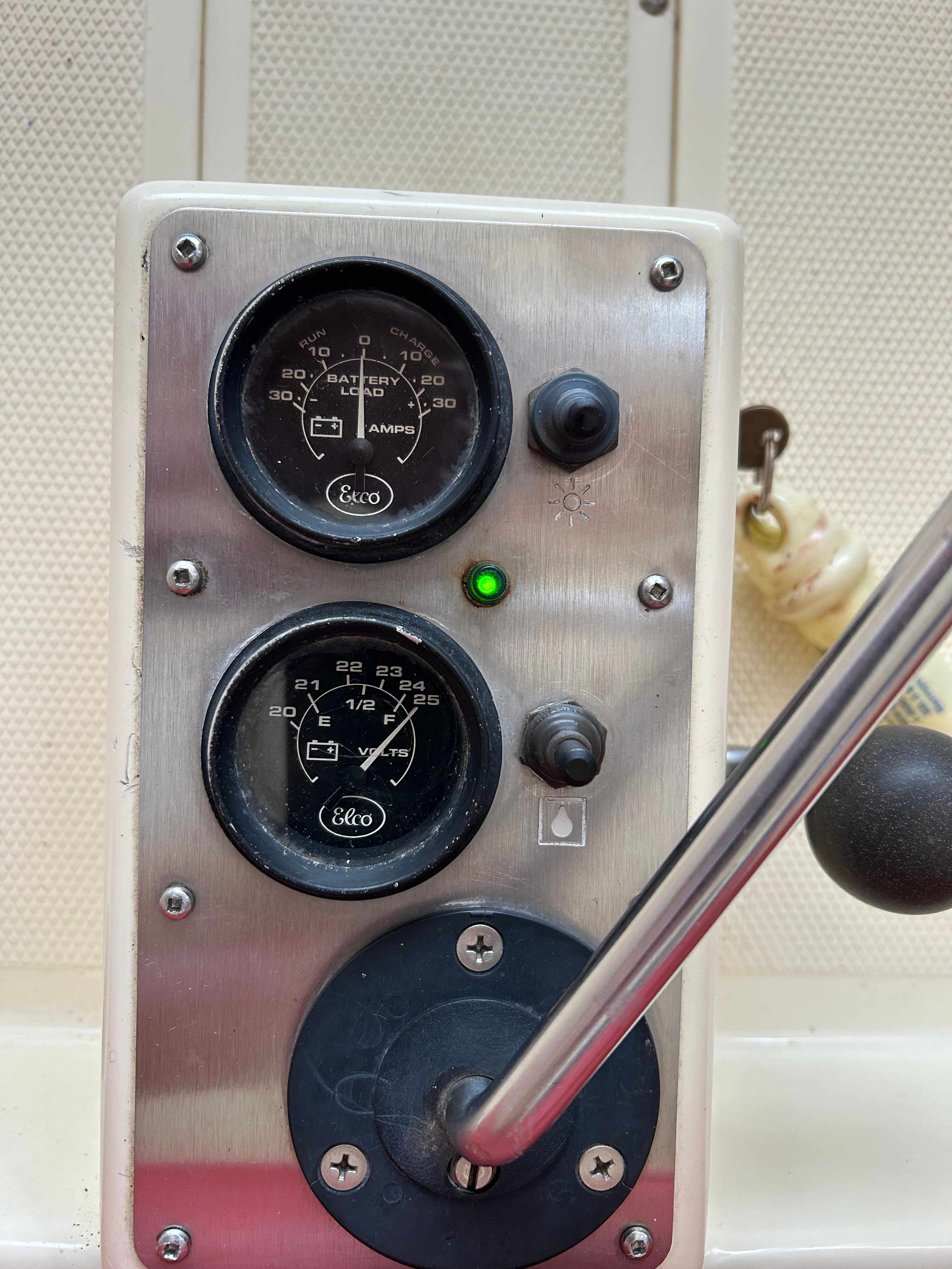 Dashboard of a 1995 Elco Launchboat with gauges and lever.