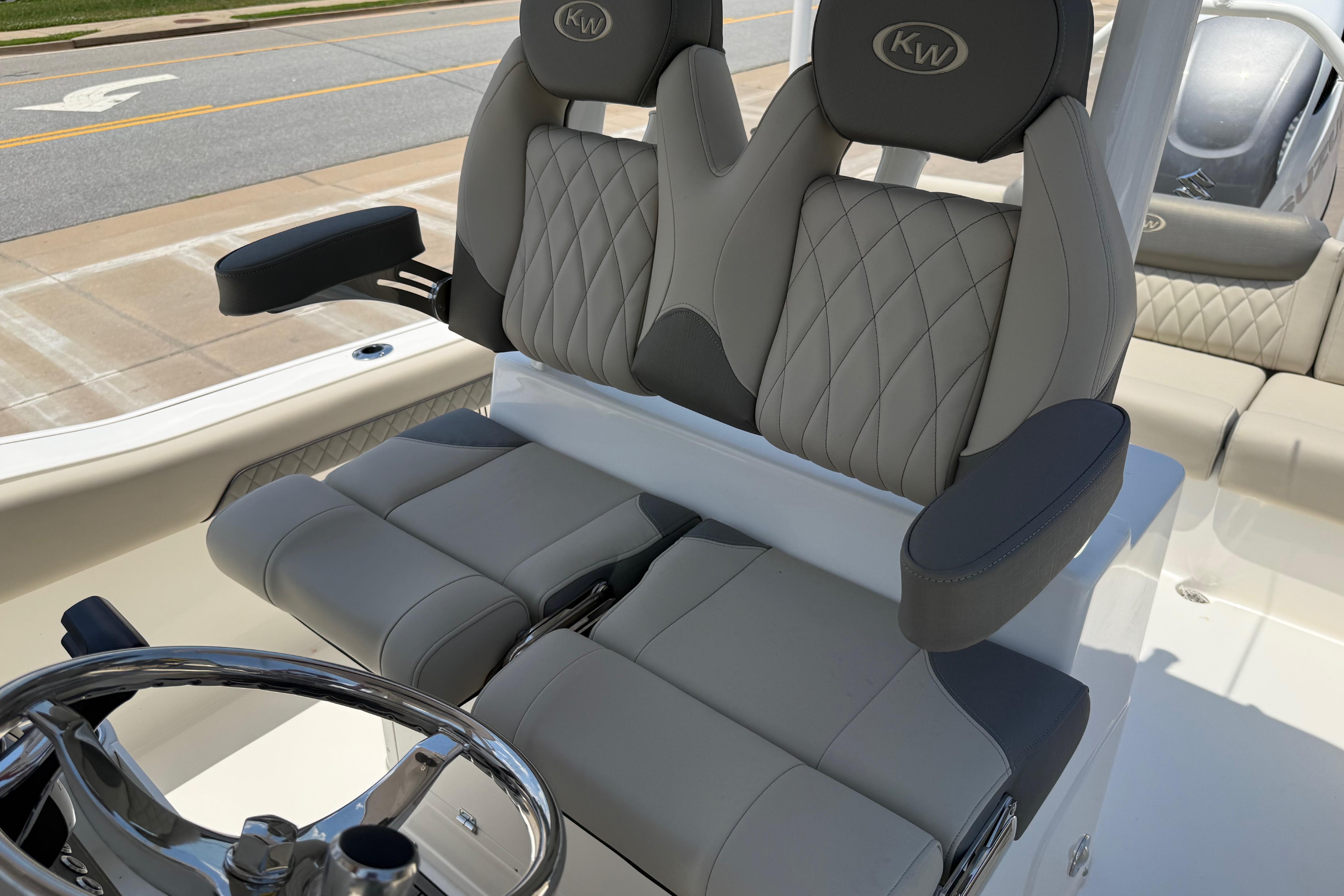 2027 Key West 249 FS boat seats with quilted design and armrests.