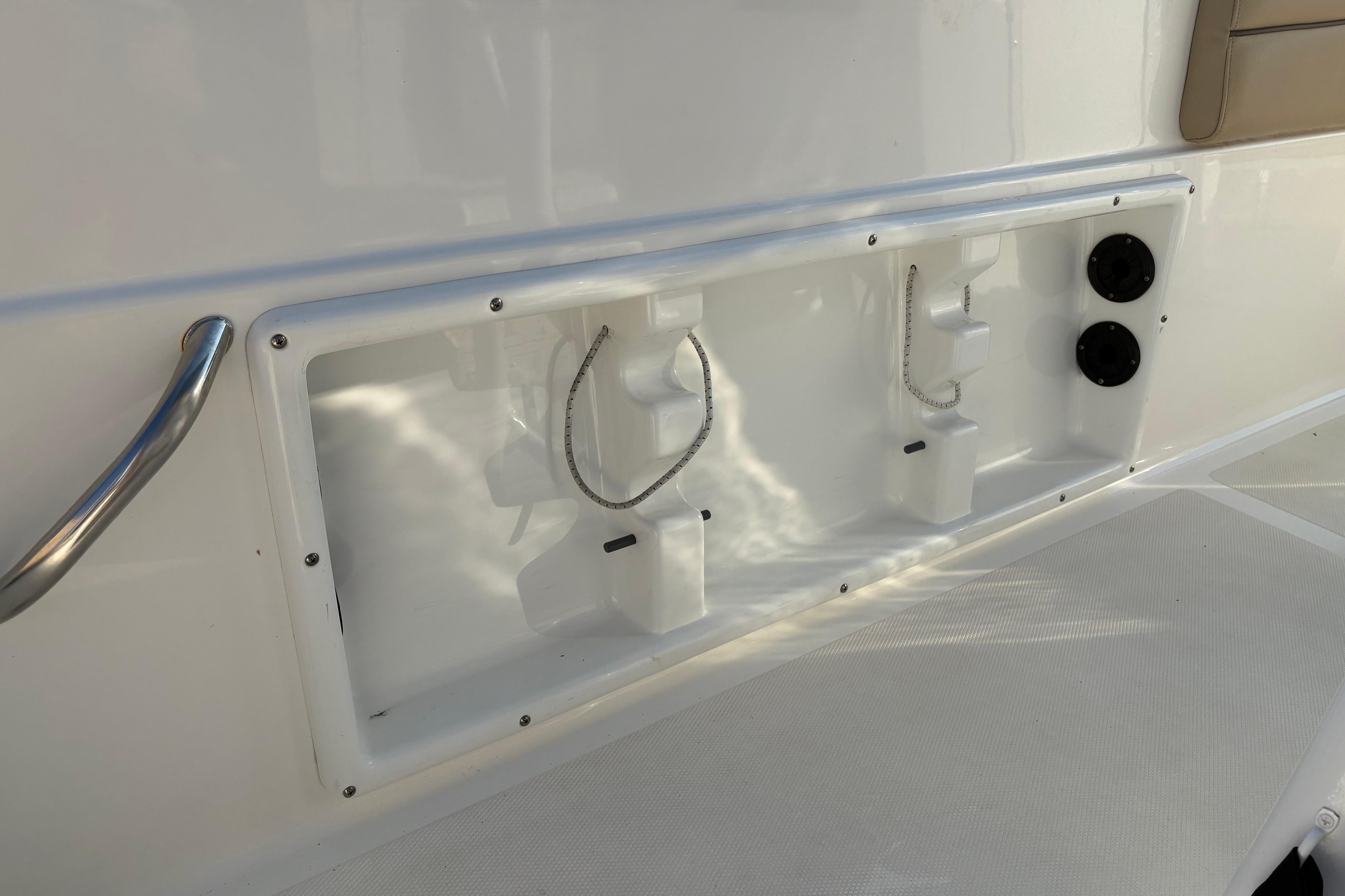 2019 NauticStar 231 Hybrid boat interior detail with storage compartments and fixtures.