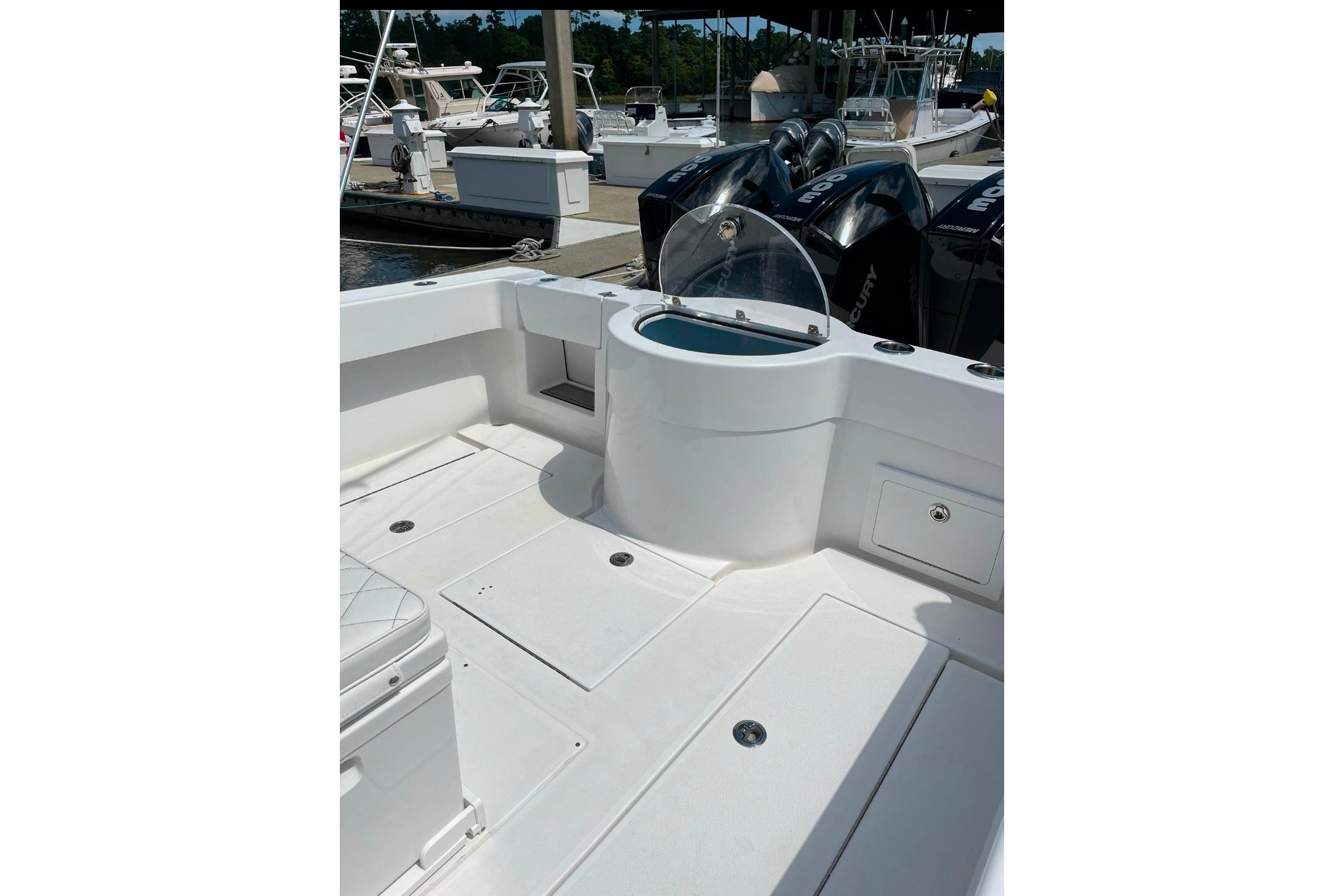 2024 Onslow Bay 33 Tournament boat interior with seating and storage compartments.