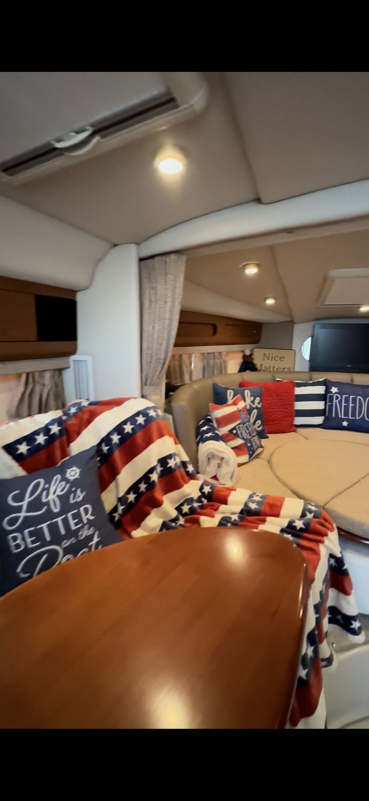 The interior of a 2004 Chaparral Signature 330, decorated with American flag motifs.