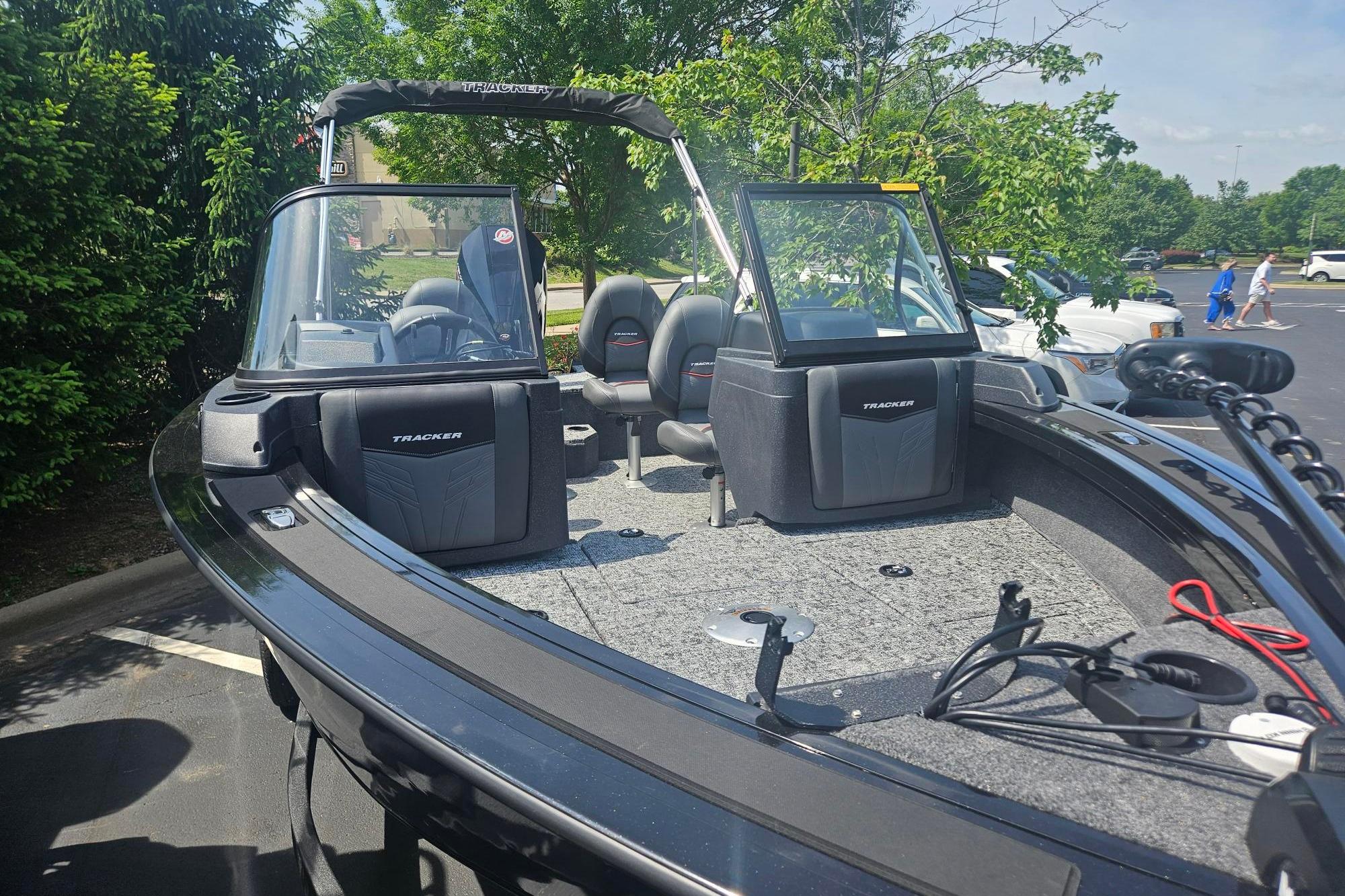 2026 Tracker Targa V-19 Combo boat with seating, parked outdoors.
