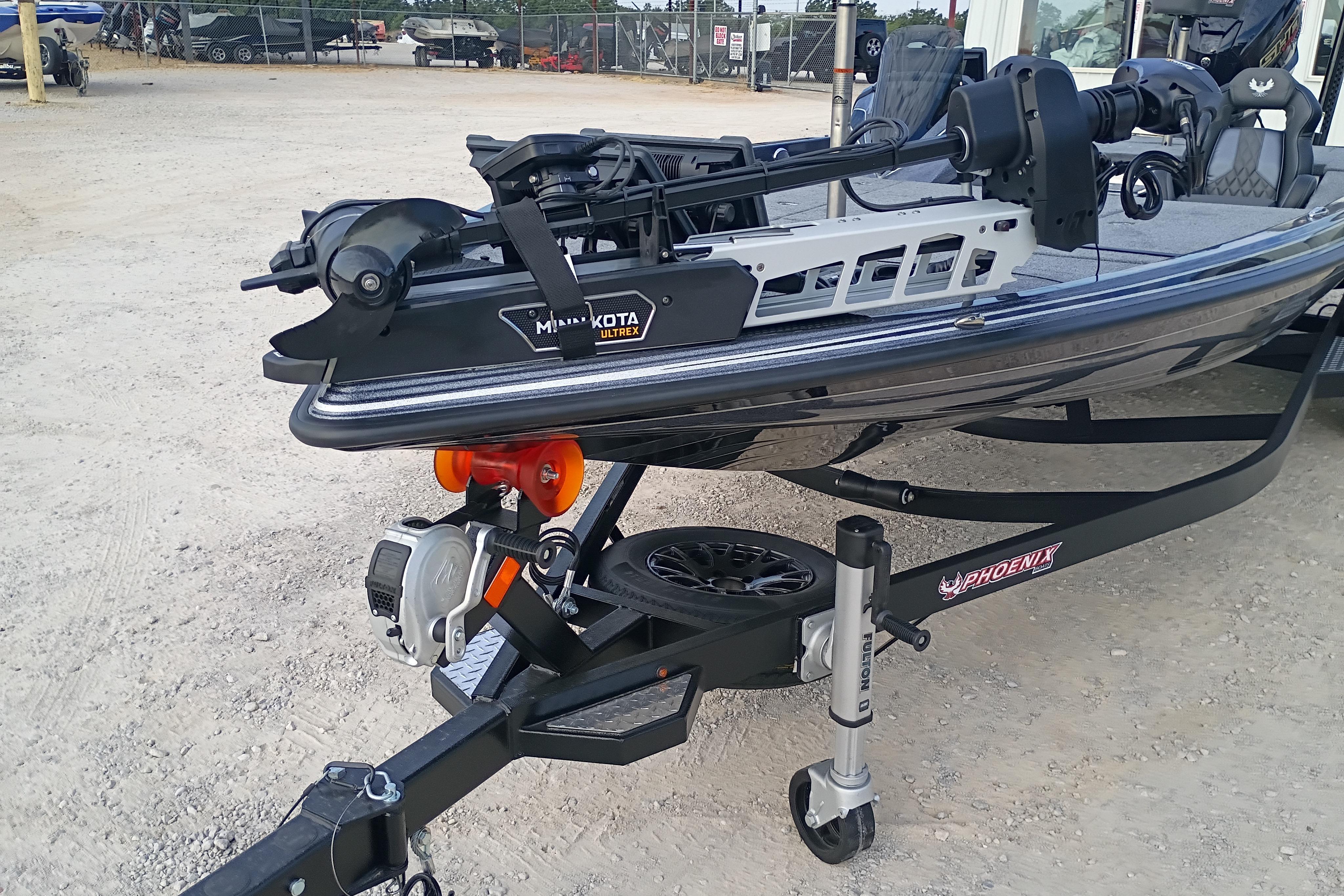 2026 Phoenix 921 ELITEX boat with Minn Kota Ultrex motor on trailer.