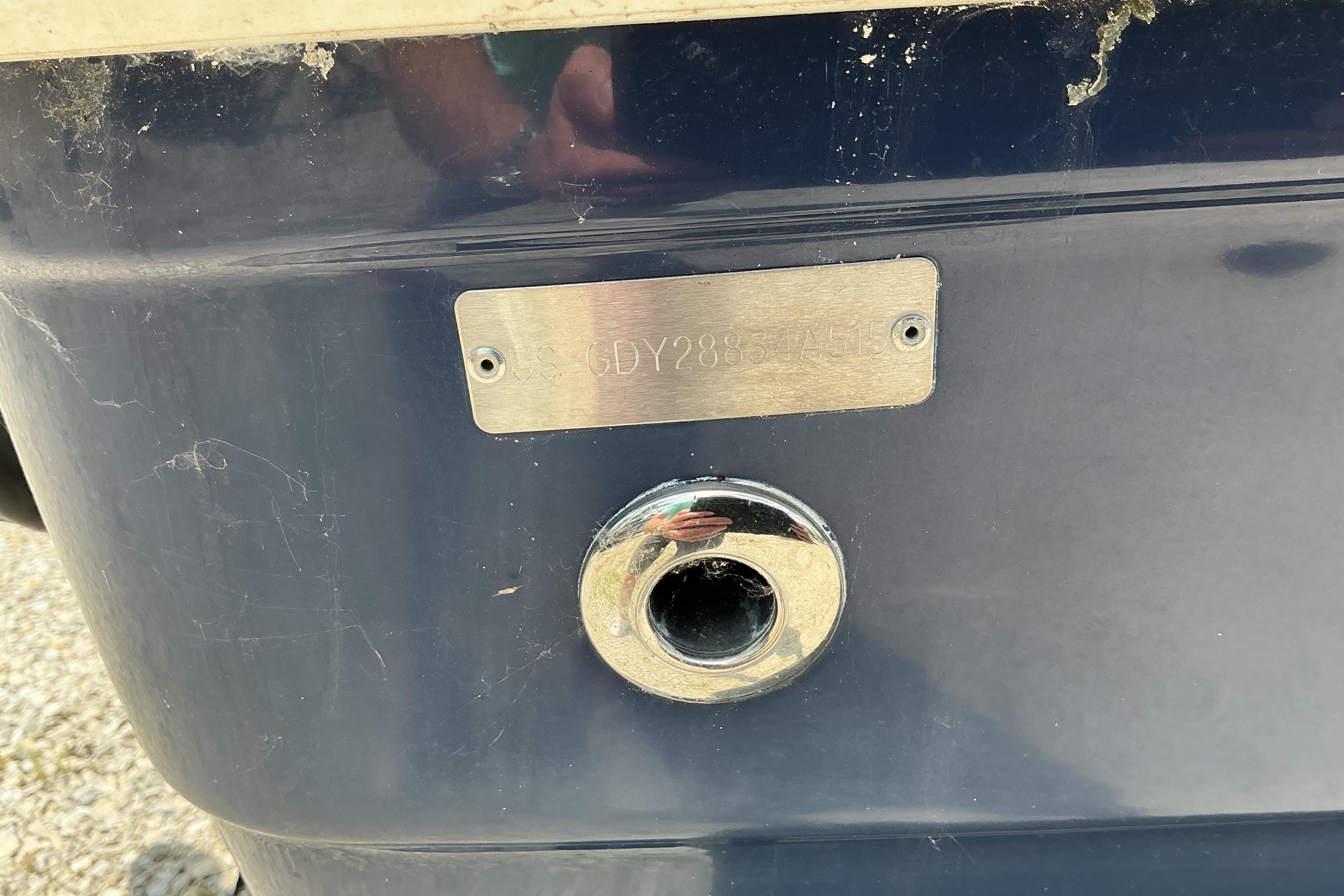 2015 Hurricane SunDeck 187 IO boat hull with identification plate and drain plug.