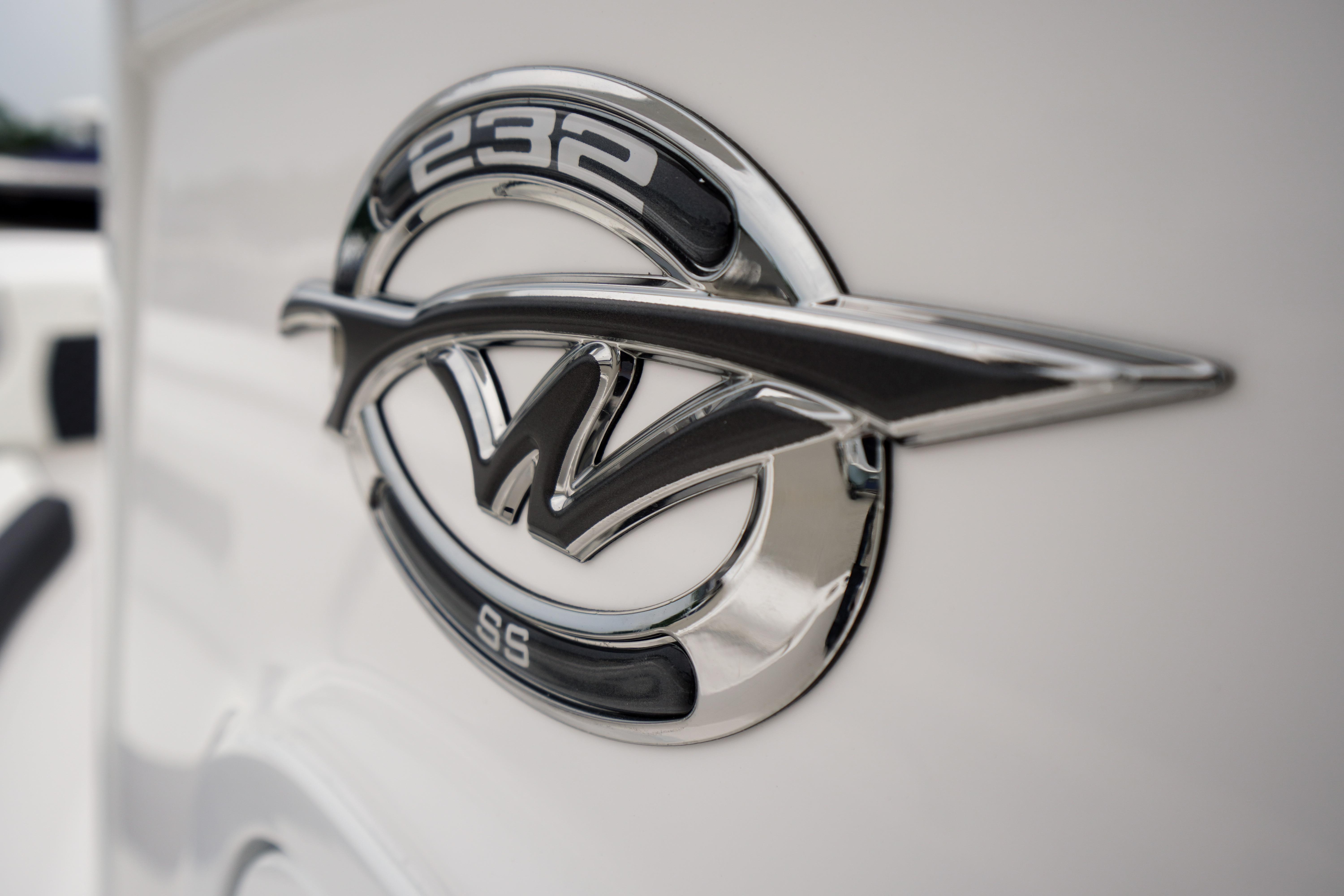 Close-up of 2026 Tidewater 232 SS emblem on a sleek white surface.