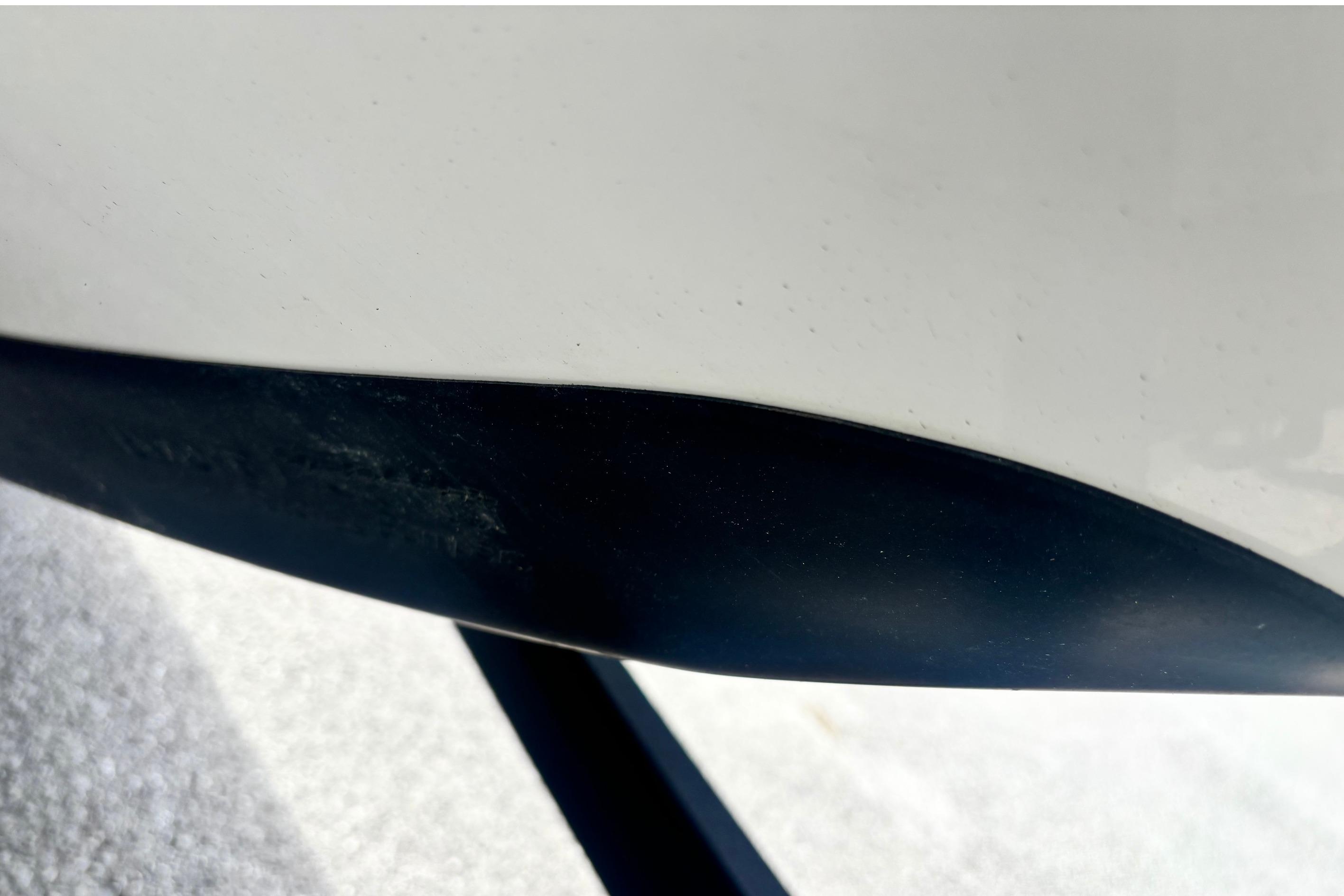 Close-up of a 2022 Ranger 1880MS boat hull, showing sleek design details.