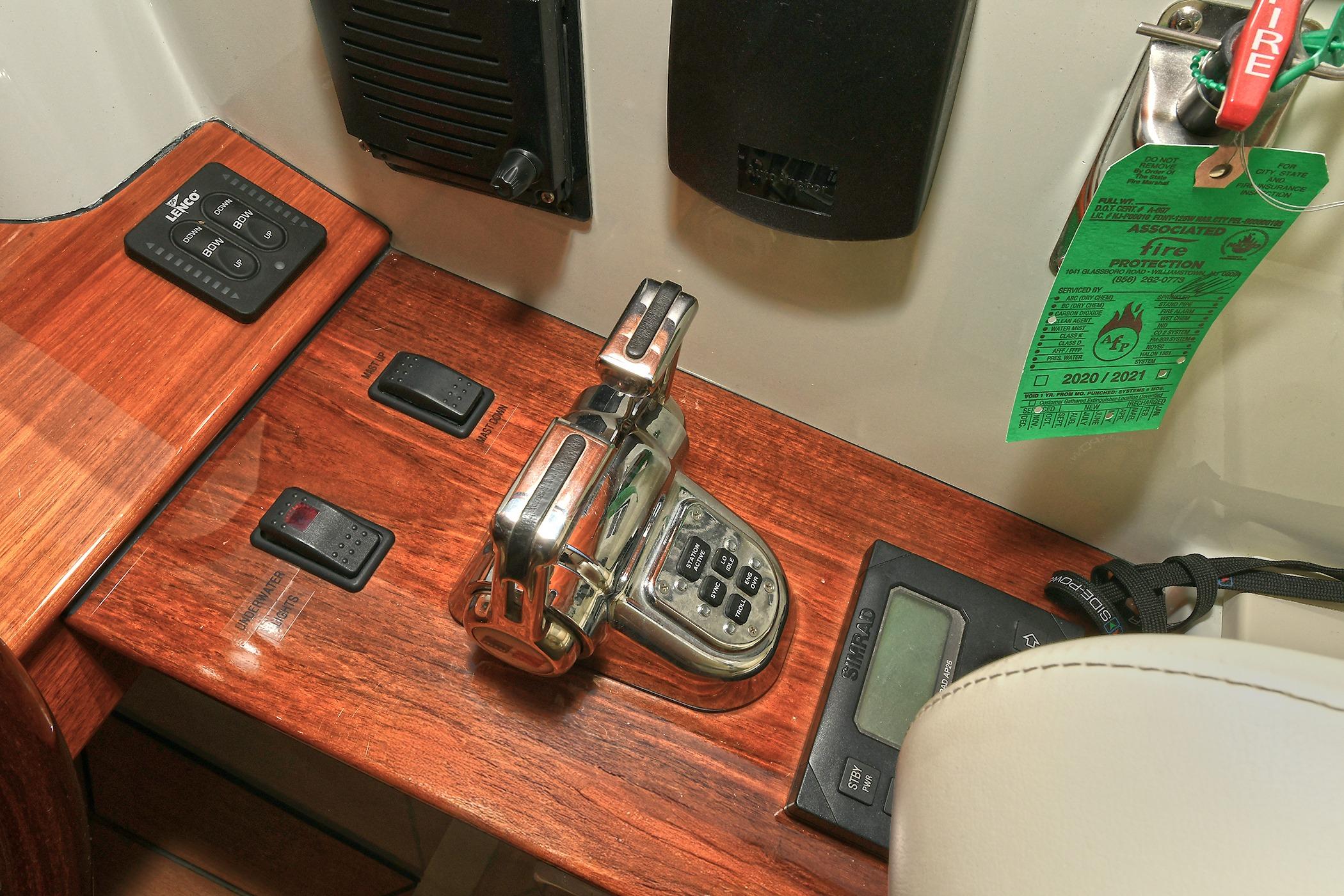 Control panel of a 2005 San Juan Downeast Express boat with fire protection tag.