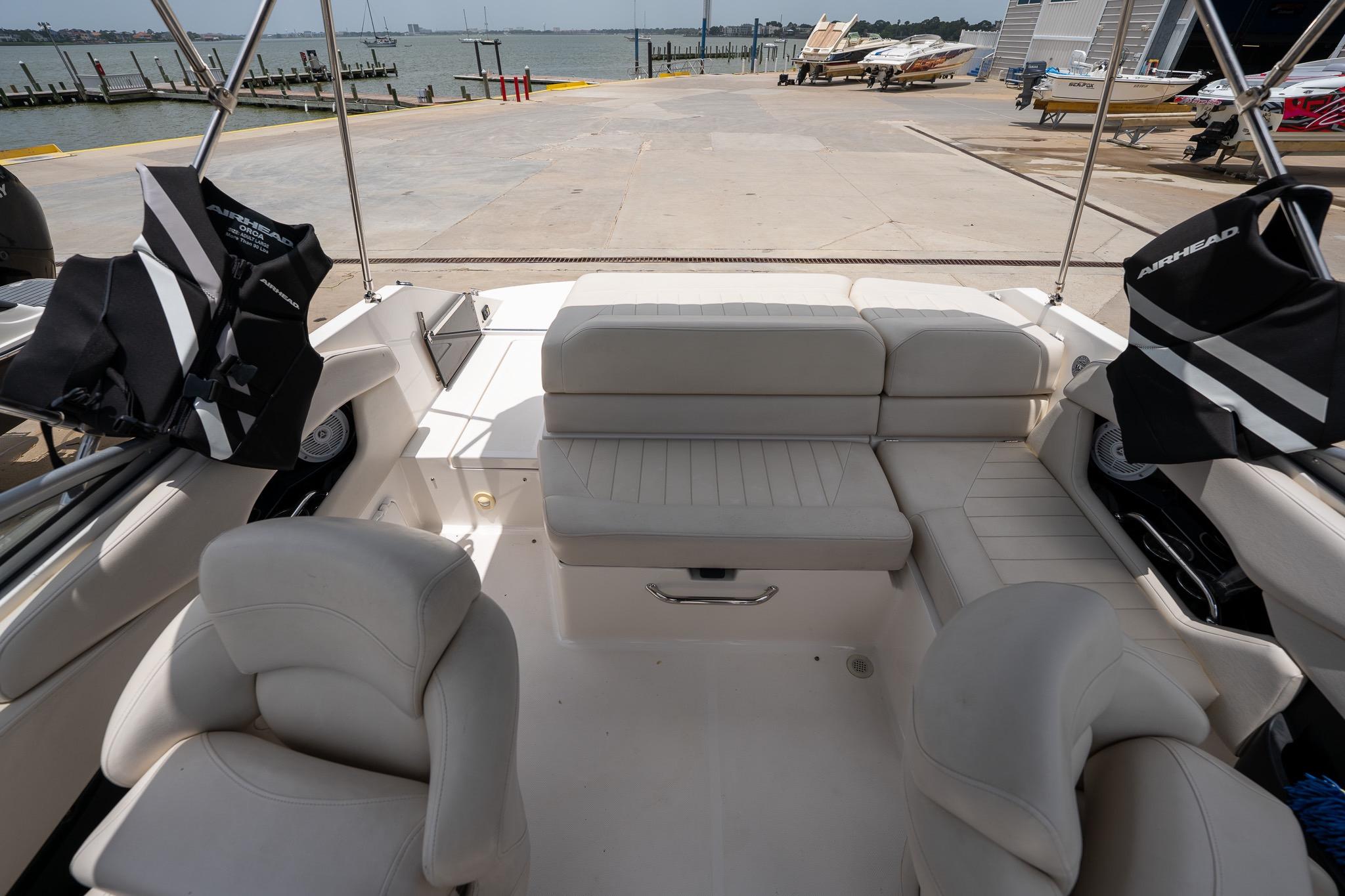 Interior of 2008 Regal 2000 Bowrider boat with seating and life jackets, dockside view.