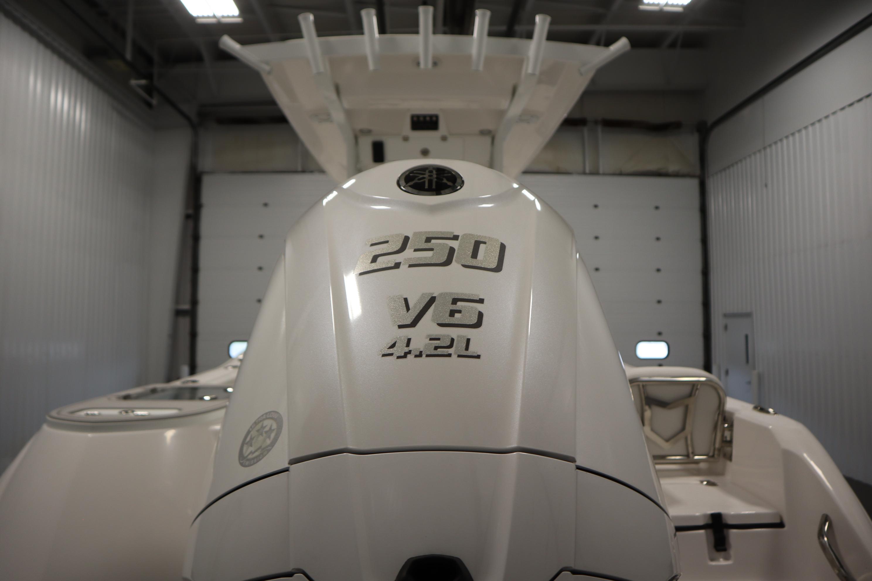 2026 Sea Fox 228 Commander with 250 V6 4.2L engine in a garage.