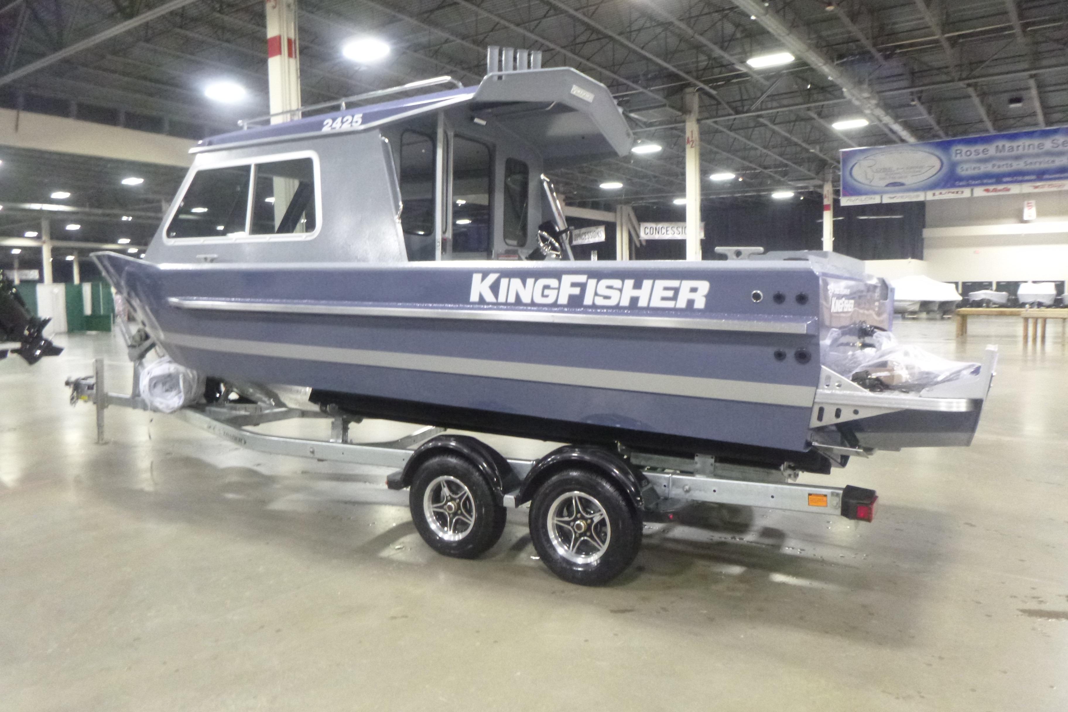 2026 KingFisher 2425 Escape HT boat on trailer in indoor showroom.