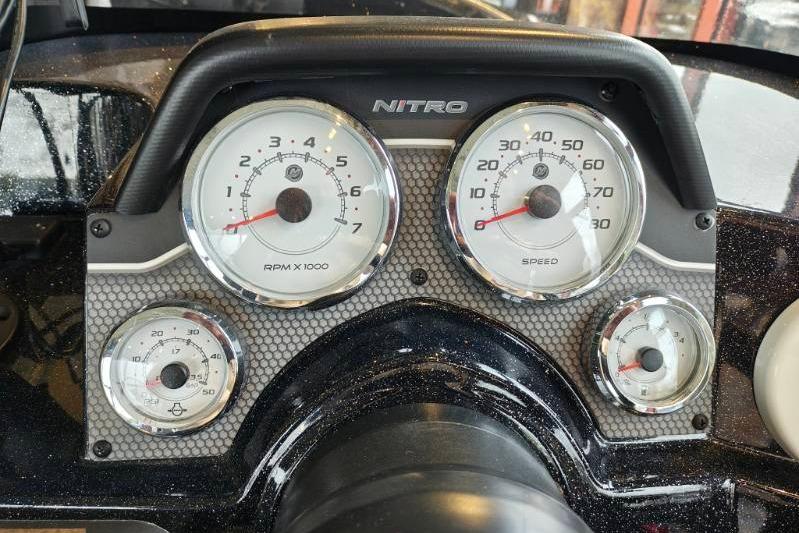 Dashboard of a 2026 Nitro ZV21 boat with RPM and speed gauges.