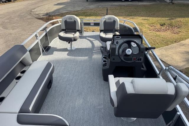 2026 Sun Tracker Bass Buggy 16 XL Select pontoon boat interior with seating and steering console.